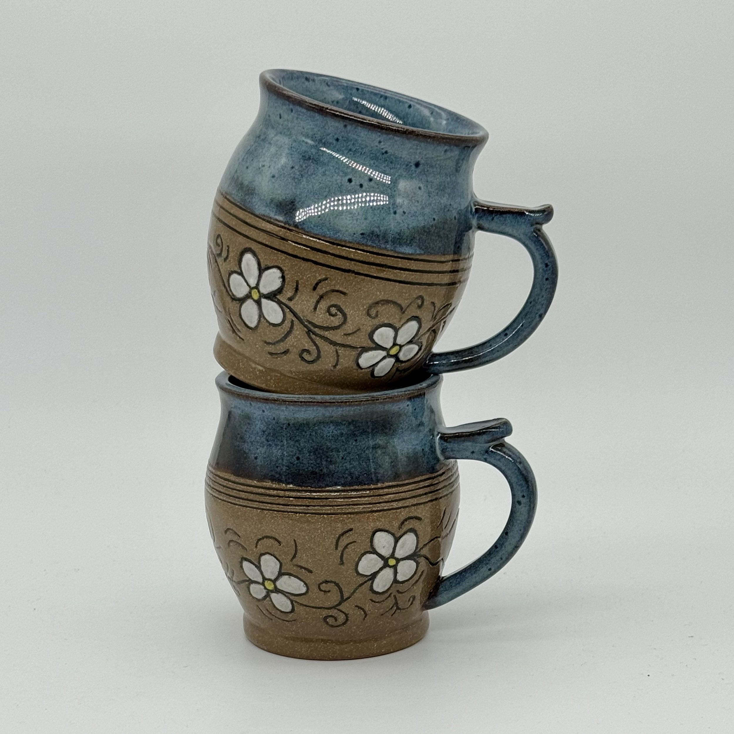 blue top sgraffito flowered bottom mugs 2 stacked.jpeg