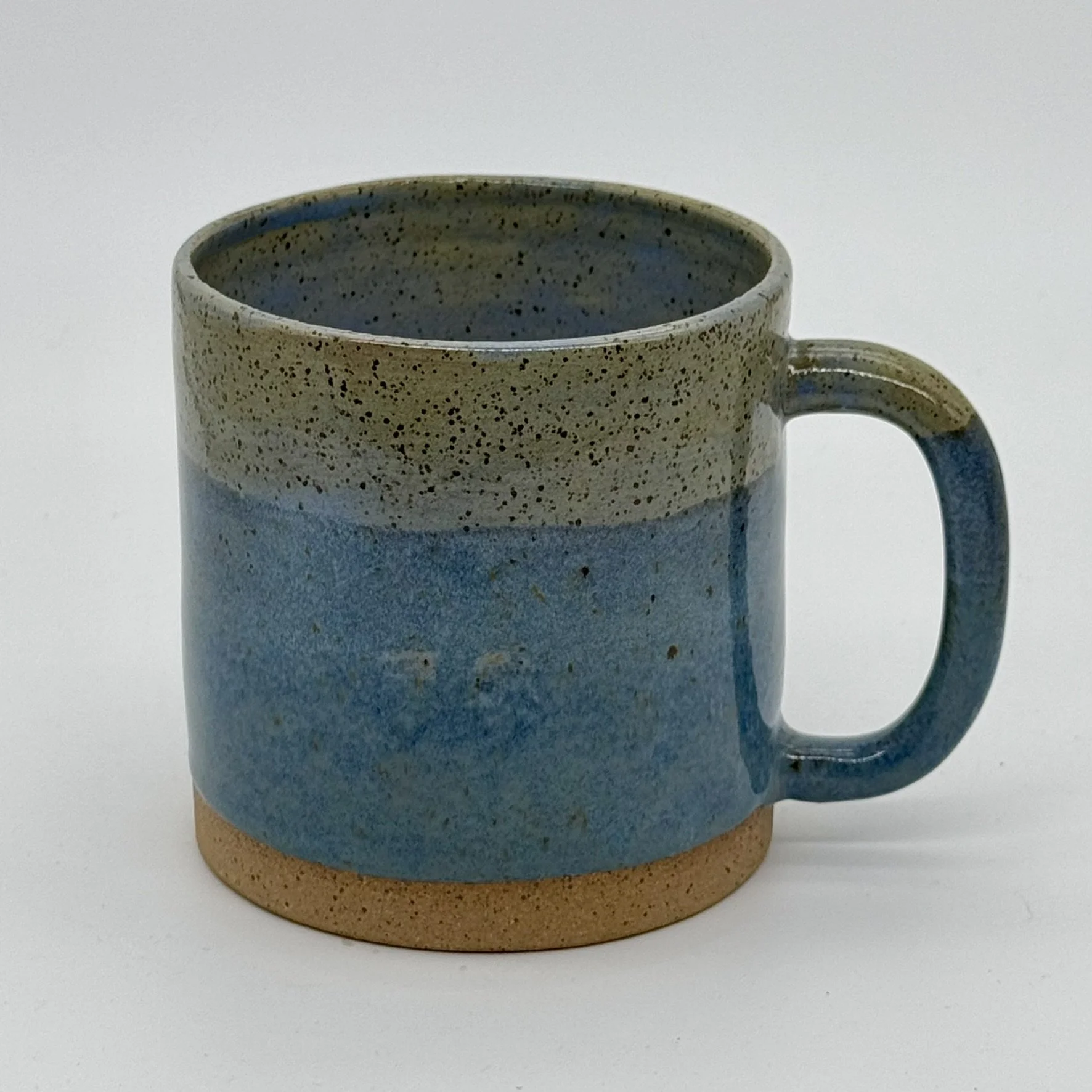 3 layer blue glaze cylinder mugs speckled brown clay.JPEG