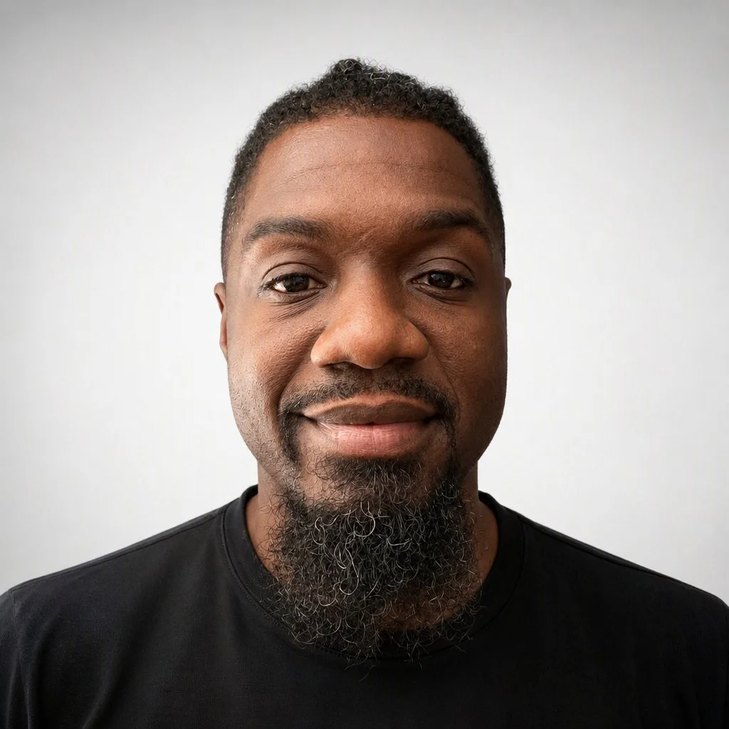 Portrait of Darnard against a smooth gradient background, used for website profile section