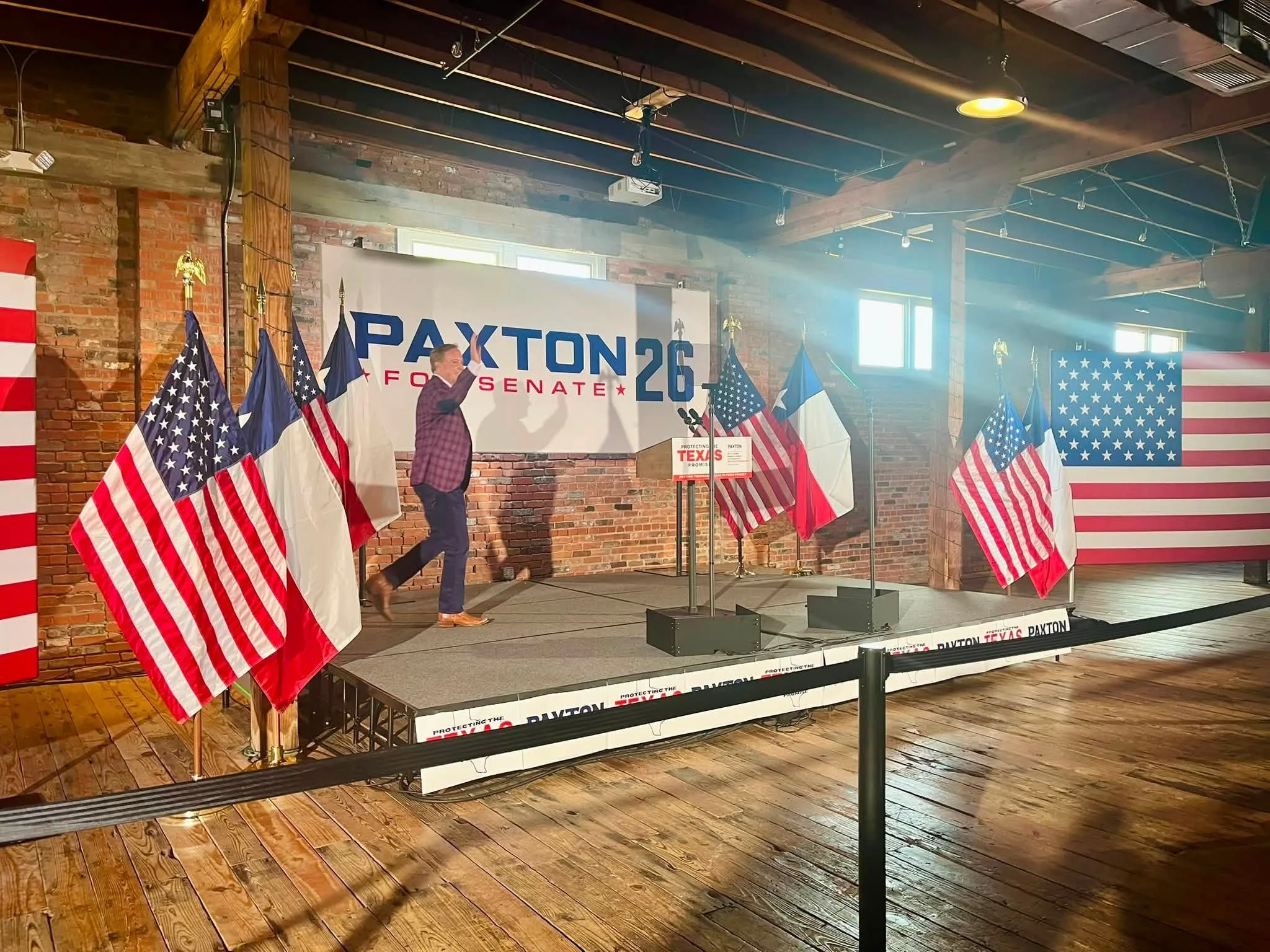 A stage with a large banner displaying 