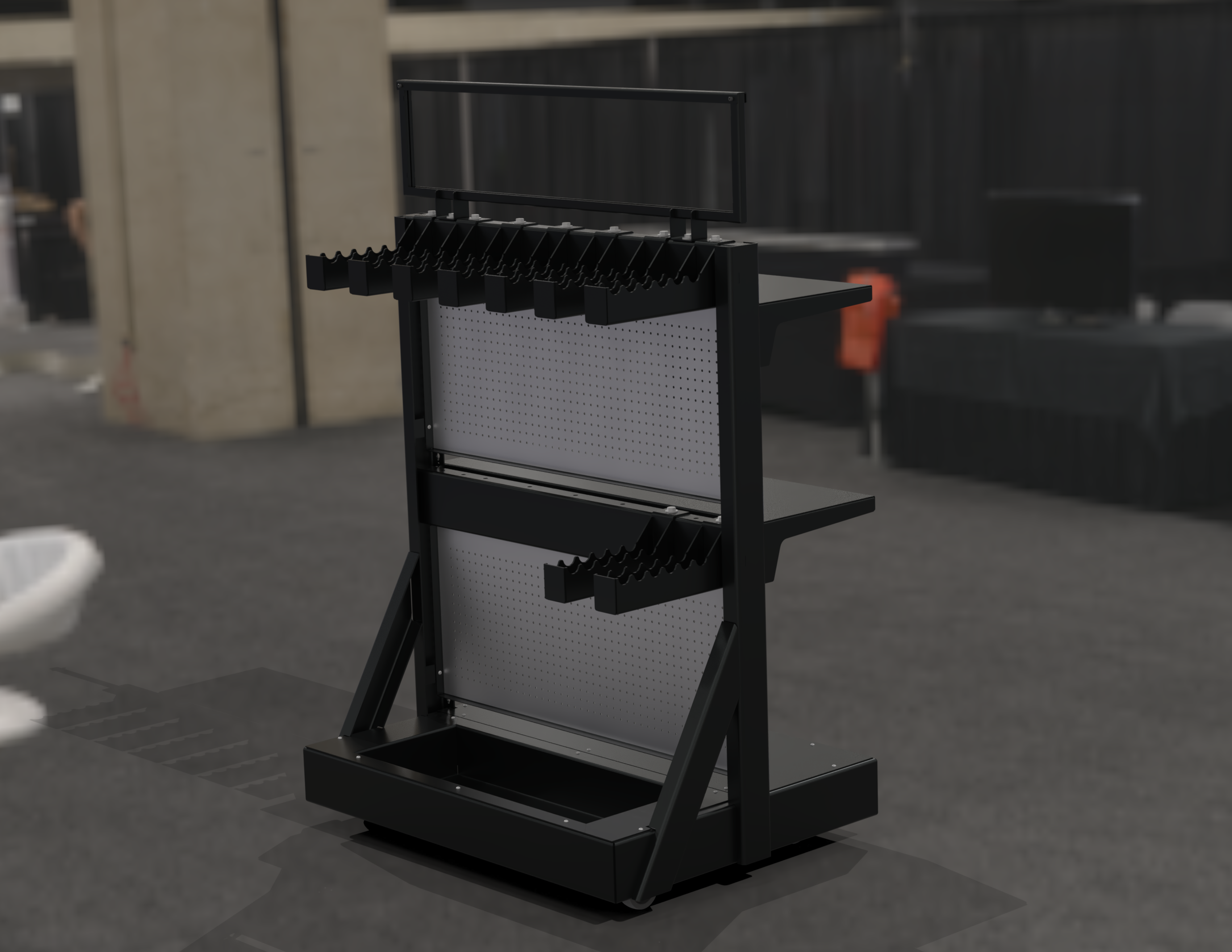 A black and white display stand with multiple tiers and a rectangular frame on top, situated in an industrial or warehouse setting.