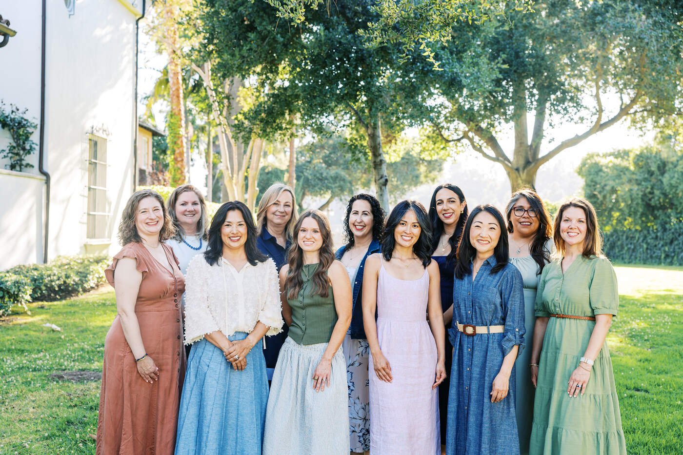 Members of The Village Therapy Collective standing together outdoors.