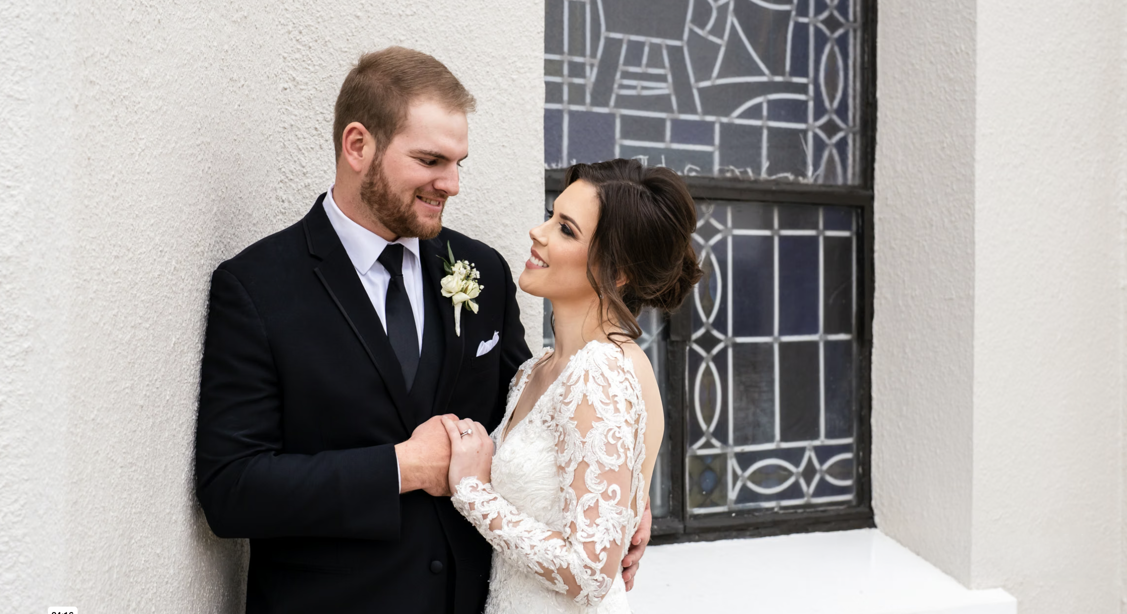 Newlywed Couple embrace after wedding ceremony.