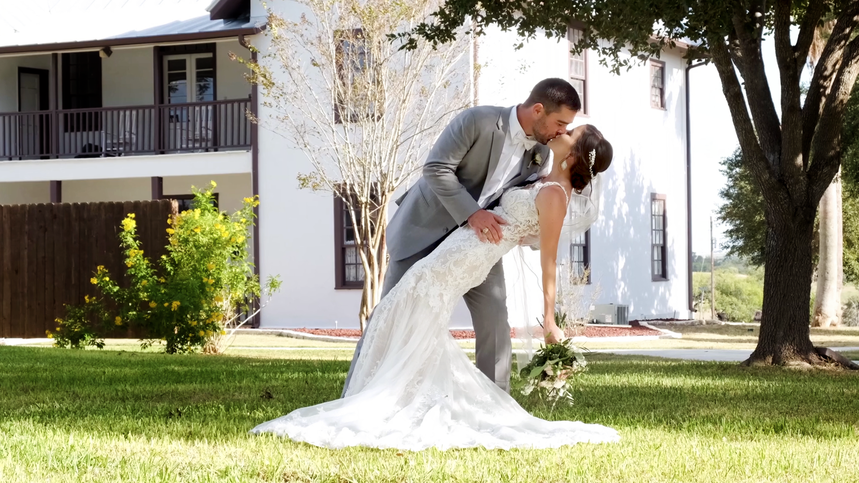 Bride and Groom share a romantic kiss after ceremony.