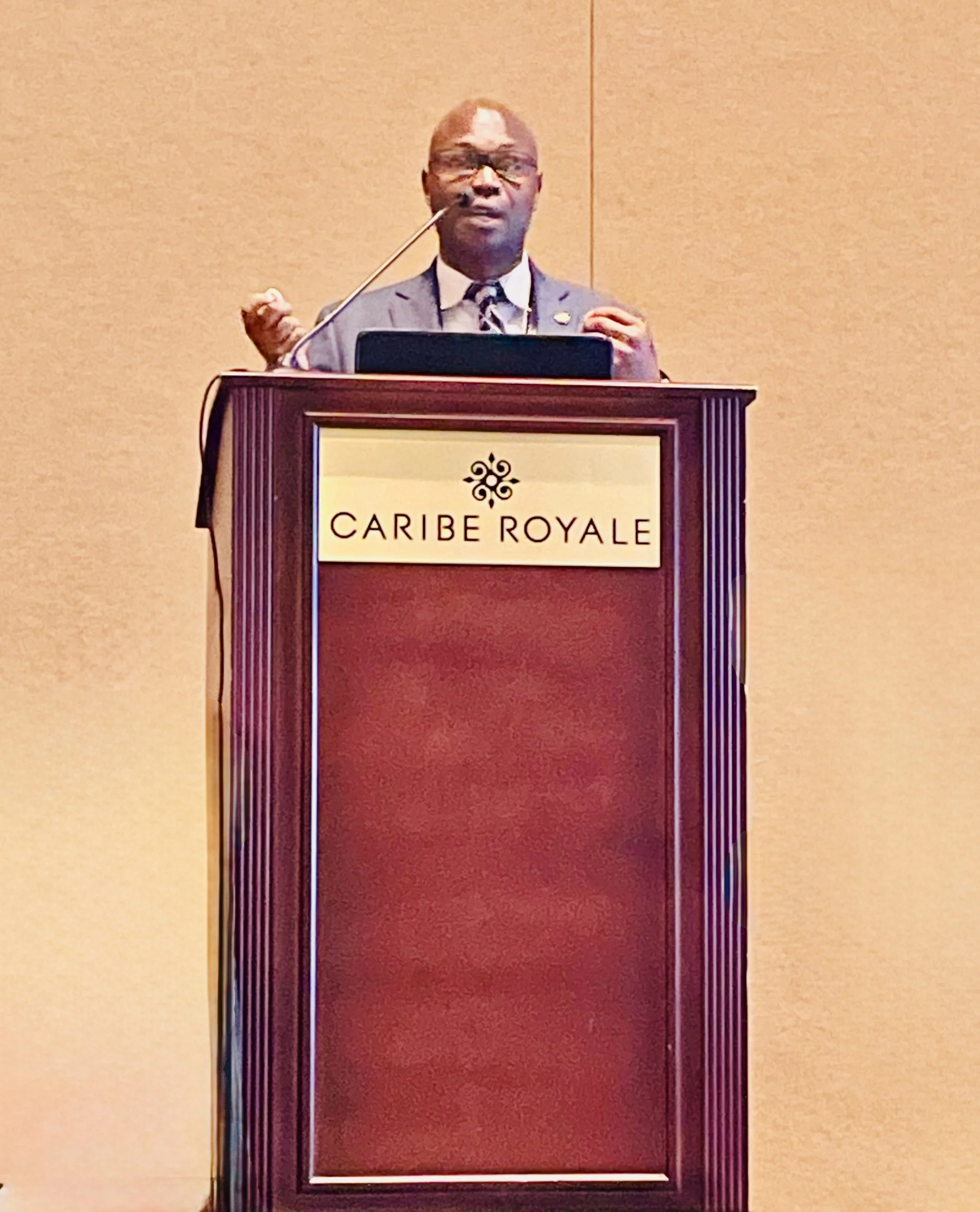 Chris Butler, The Fingerprint, delivering a keynote at the podium