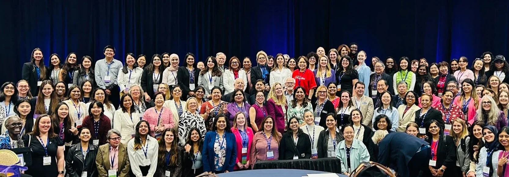 Diverse women and men at an IEEE international conference, where Tom Murad, Ph.D., P.Eng. supports through mentorship and recognizing Women in Engineering (WIE)
