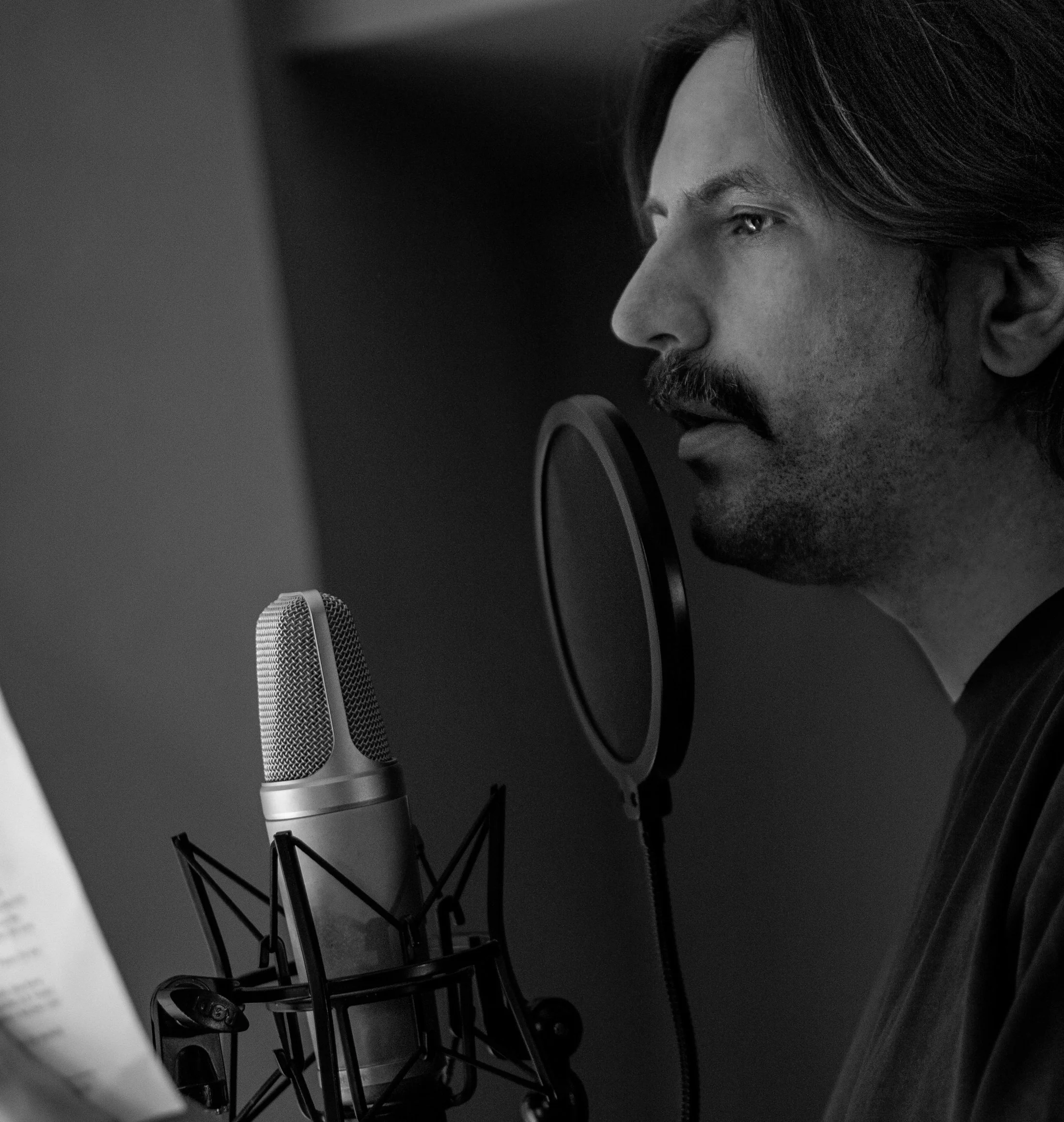 Mark in the studio recording VO for a new project.