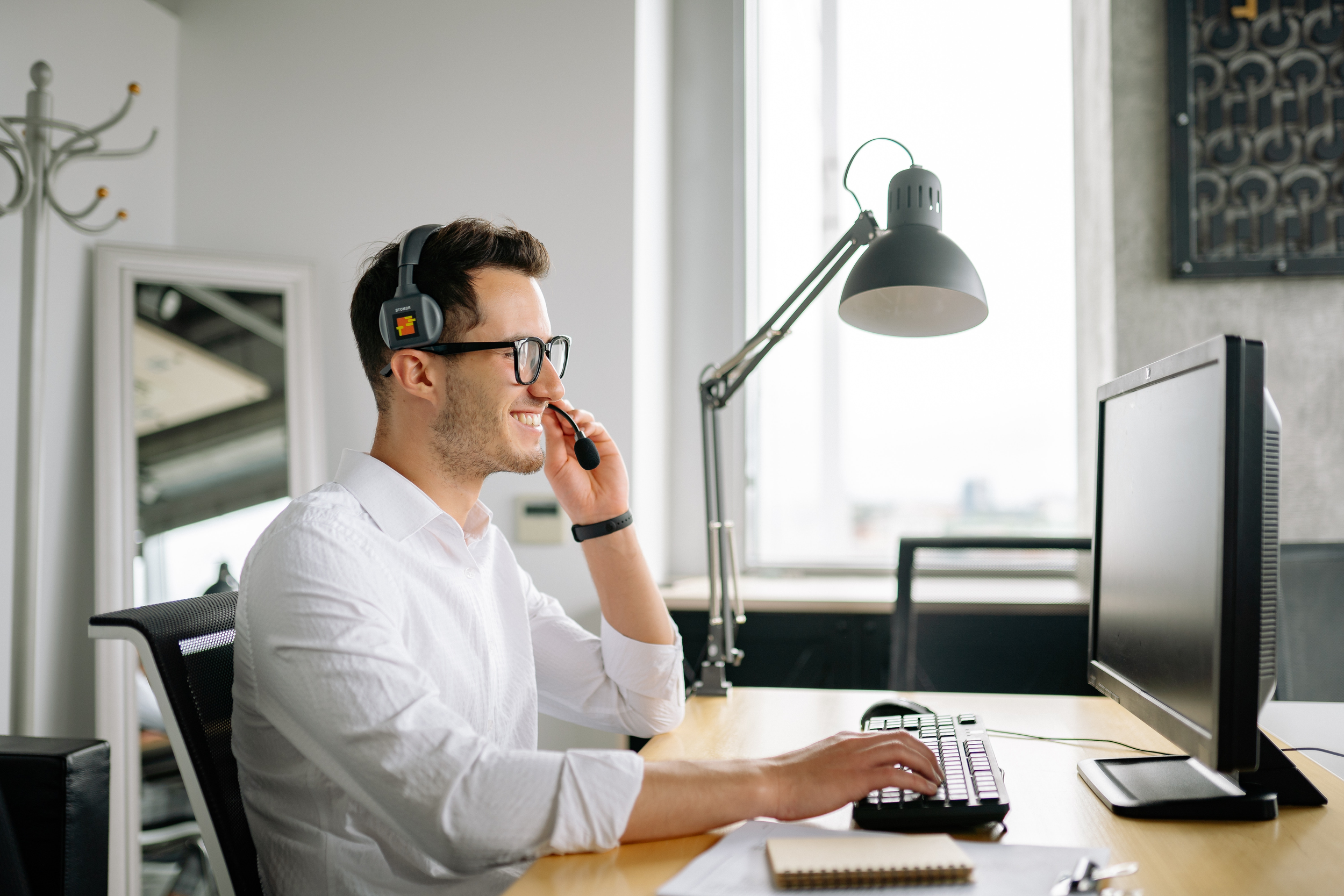 Ethos Teams dedicated virtual assistant working at office desk⁠