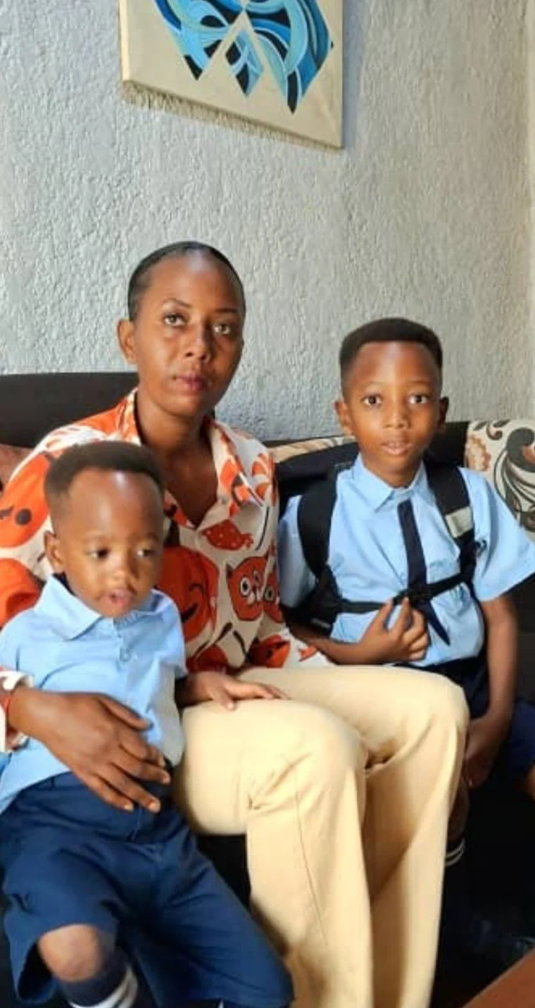 A teacher in Rwanda with her children.