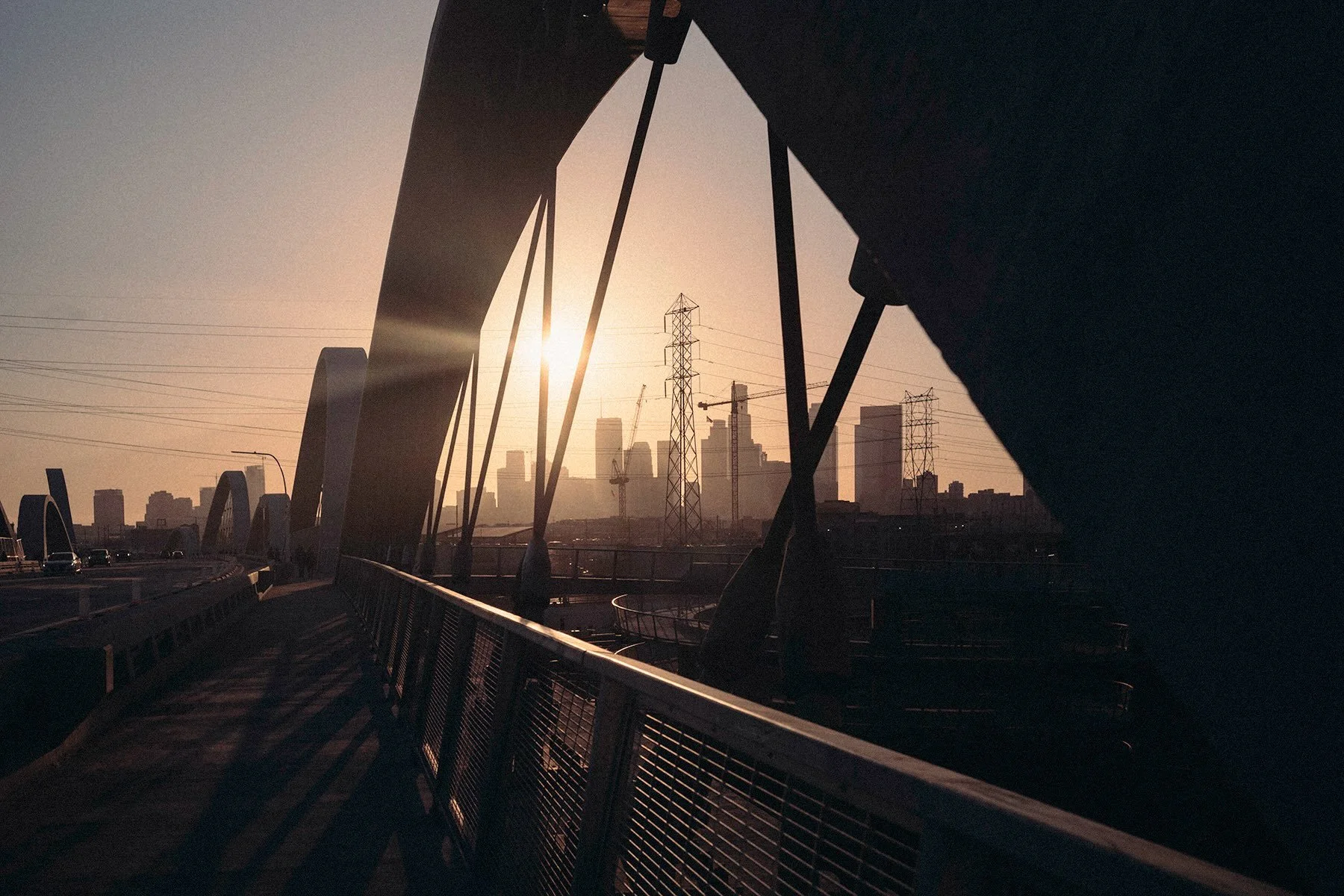 City of Angels. This was the first time visiting the newly reopened Sixth Street Bridge. It was definitely quite the architectural marvel with those arches rising. Walking on the bridge exploring, I found an angle that framed the city skyline in such
