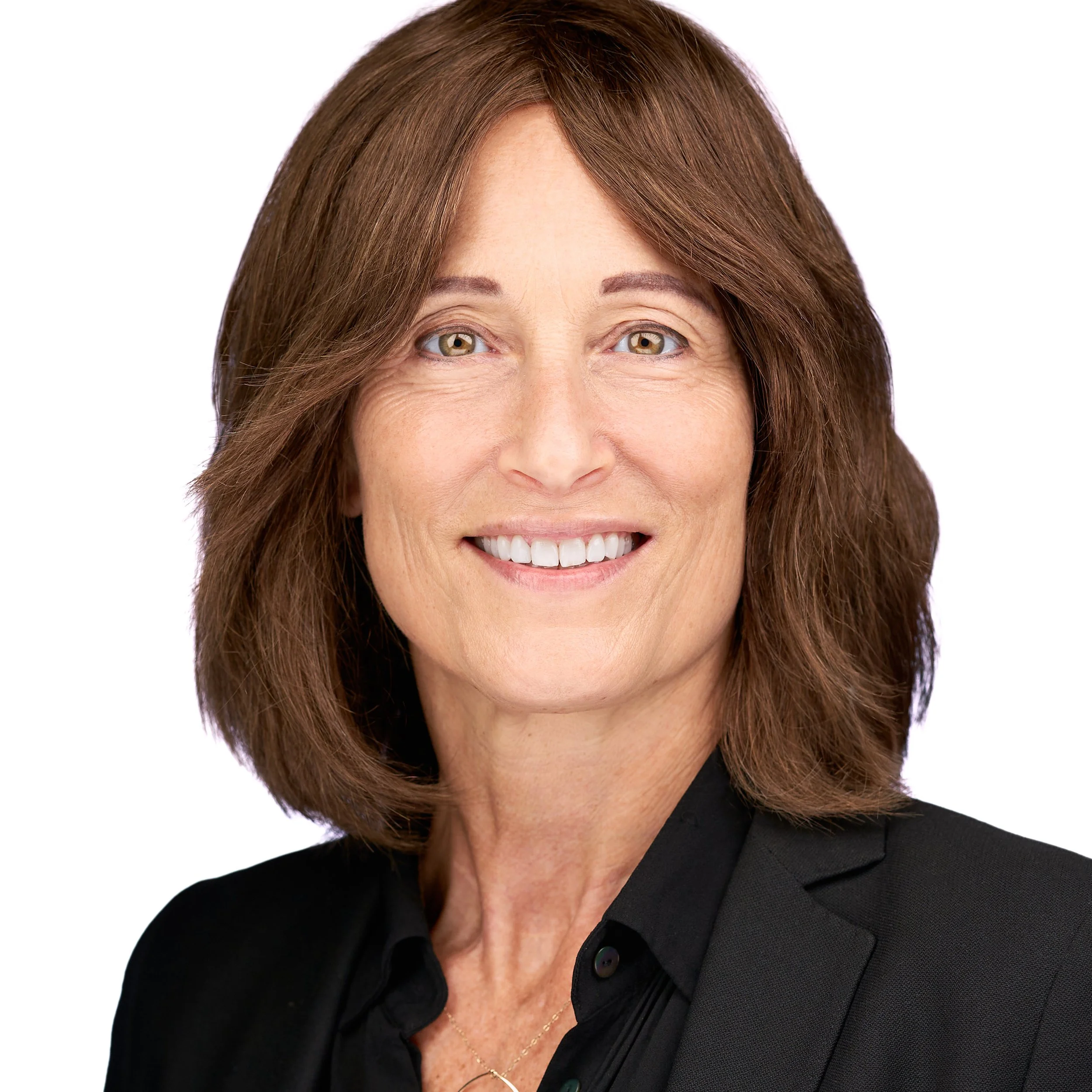 DAVIDSAGGIO Photography Tampa female pharma executive headshot. Brunette with bright smile, wearing a black top against a white background.