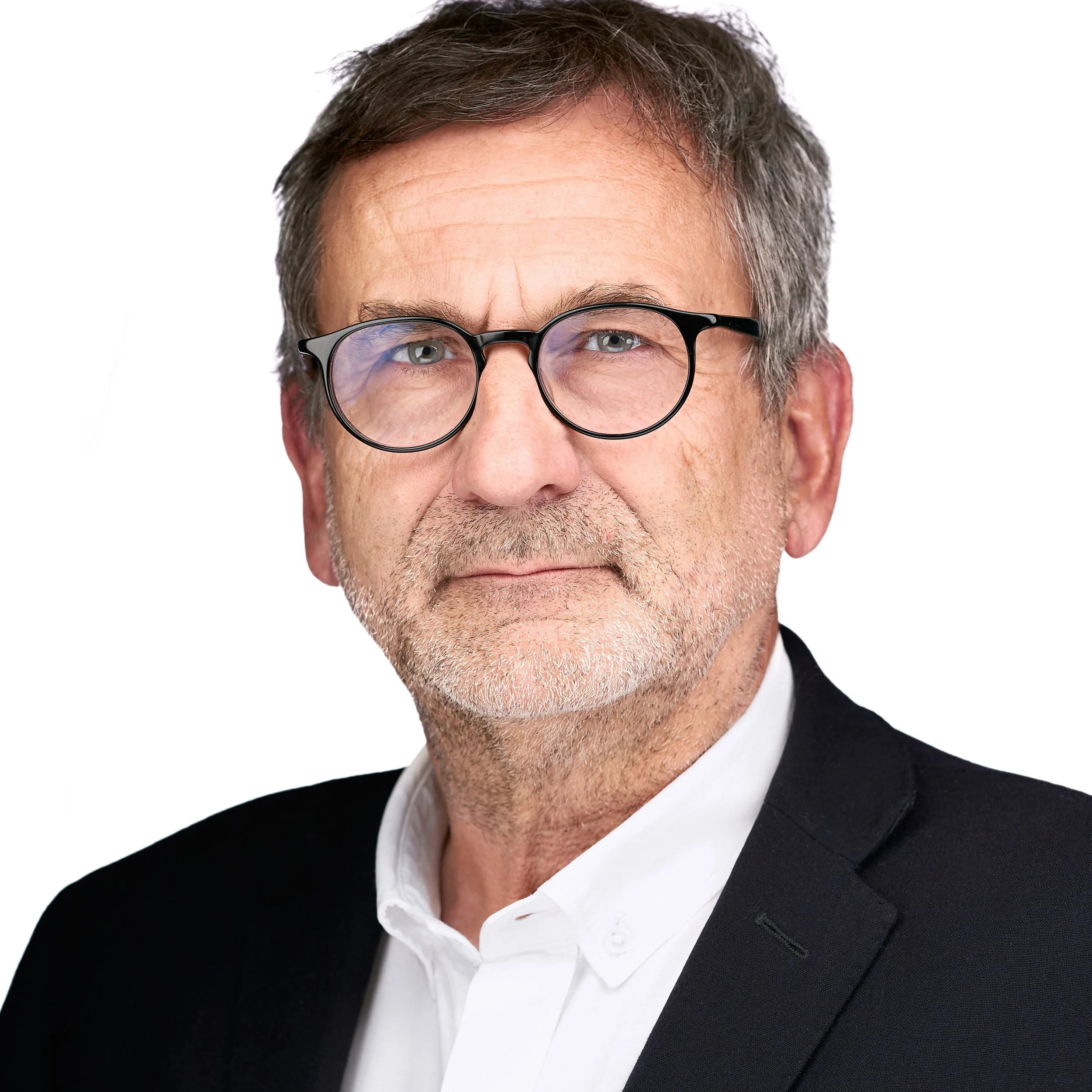 Leadership headshot of a middle-aged man with gray hair, glasses, wearing a black blazer and white shirt, against a white background. DAVIDSAGGIO Photography Tampa.