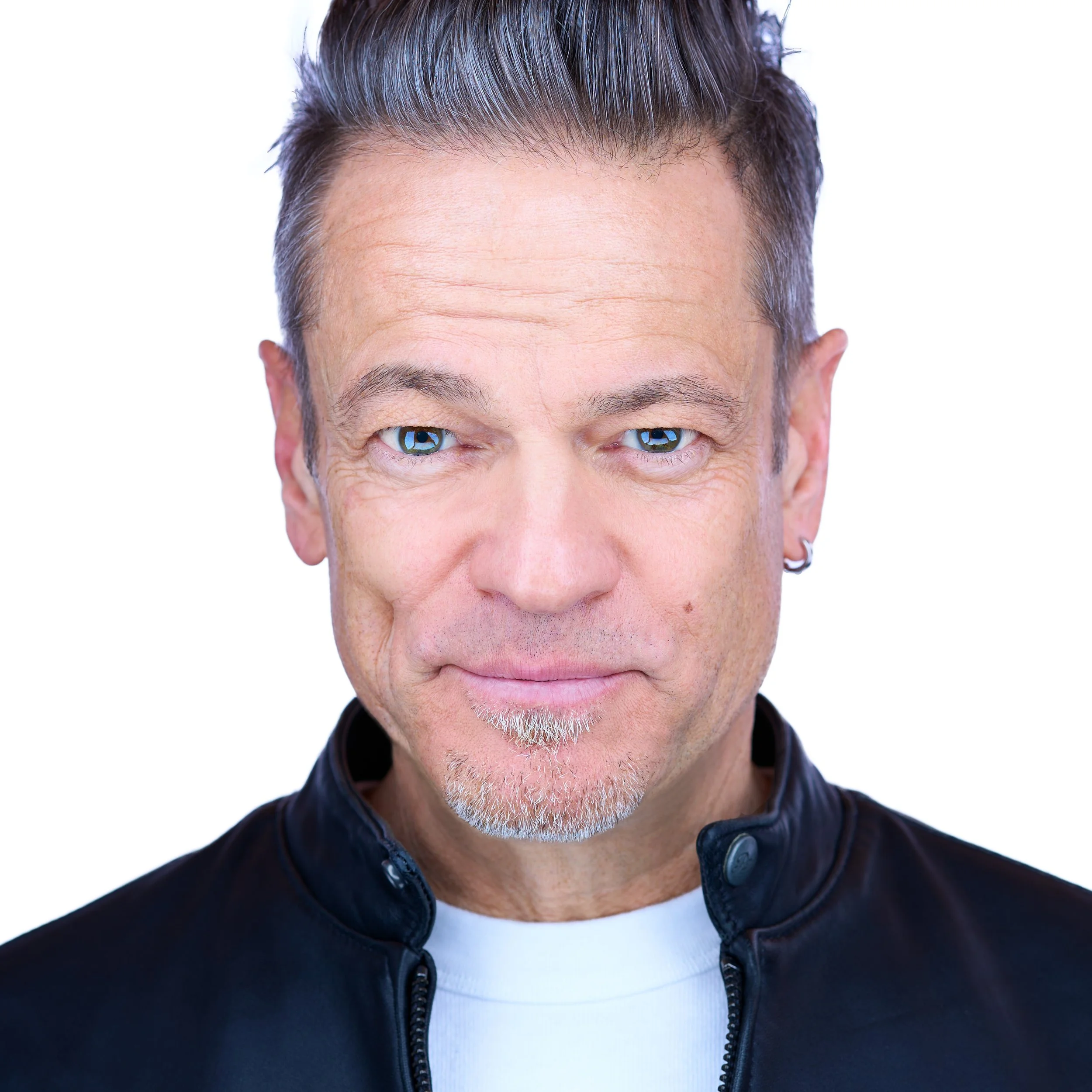 White male executive creative director headshot. Wearing white t-shirt and black leather jacket. DAVIDSAGGIO Photography Tampa 