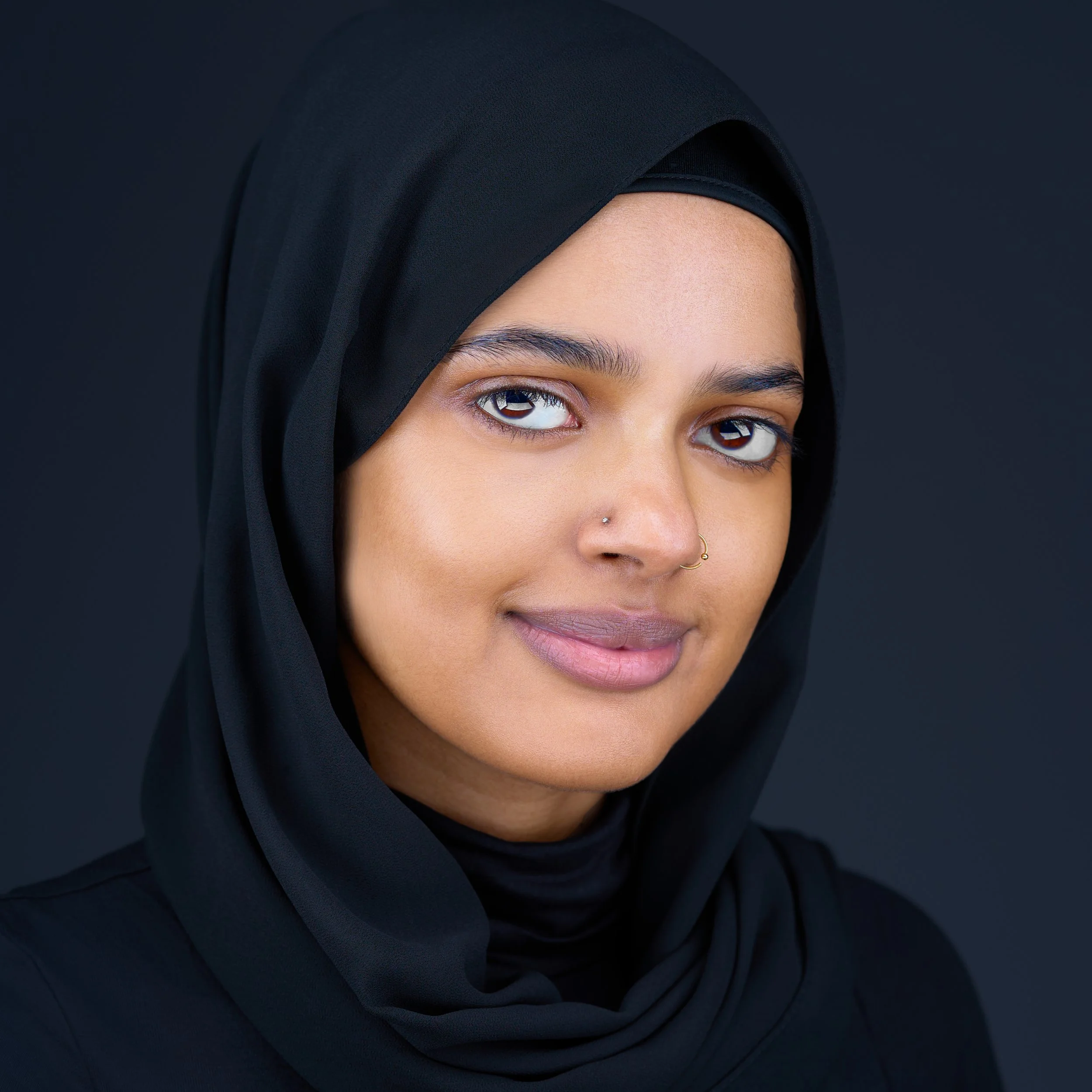 DAVIDSAGGIO studio personal headshot in Tampa. Muslim woman wearing black hijab.
