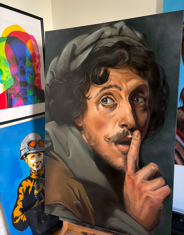 A realistic portrait of a man with dark curly hair and a mustache, holding a finger to his lips in a 'shh' gesture.