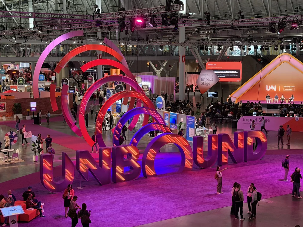 HubSpot INBOUND conference expo floor with the giant illuminated INBOUND sign