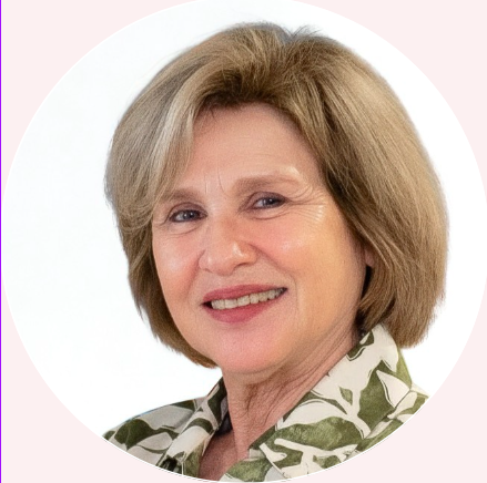 A middle-aged woman with light-colored hair smiling, wearing a patterned blouse, against a white background.
