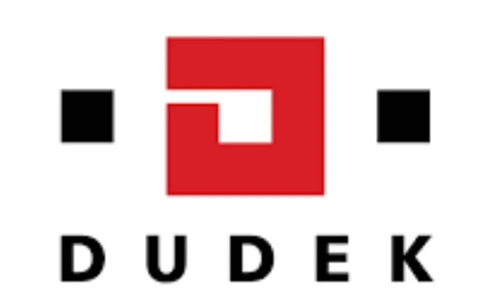 Logo with the word 'DUDEK' beneath a red geometric shape resembling a letter 'D' or abstract design, flanked by two black squares.