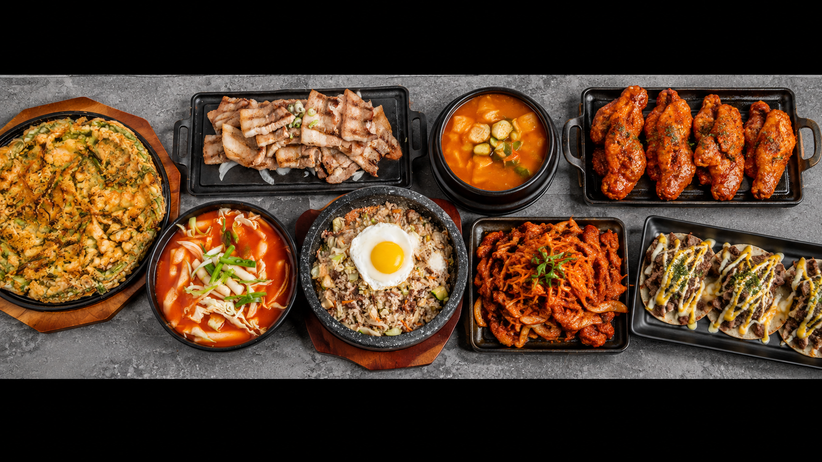 Assorted Korean dishes at The Crew Korean Restaurant in San Francisco, including Korean BBQ, fried chicken, kimchi dishes, and other favorites.