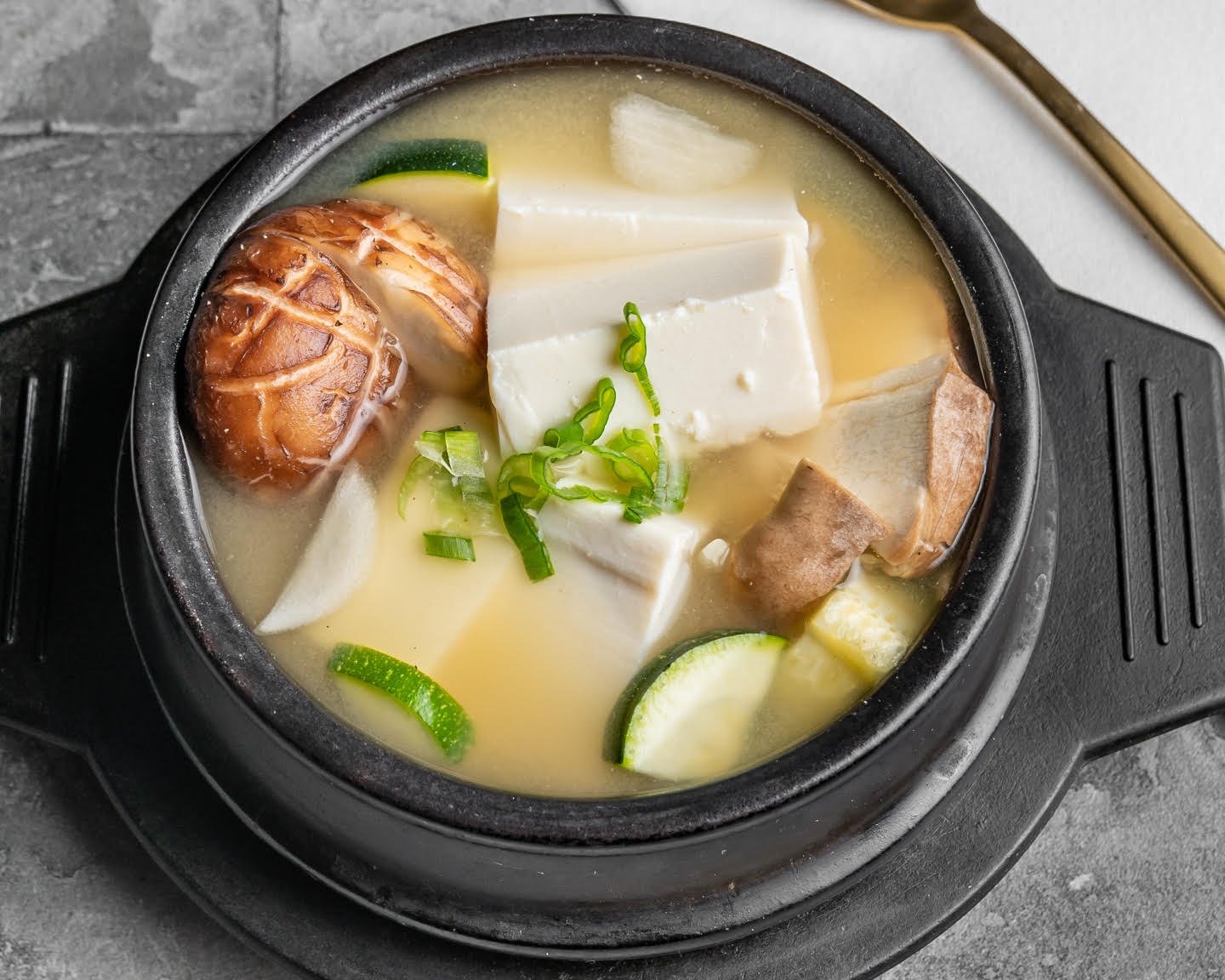 Korean tofu soup with vegetables and mushrooms at The Crew Korean Restaurant in San Francisco’s Sunset District.