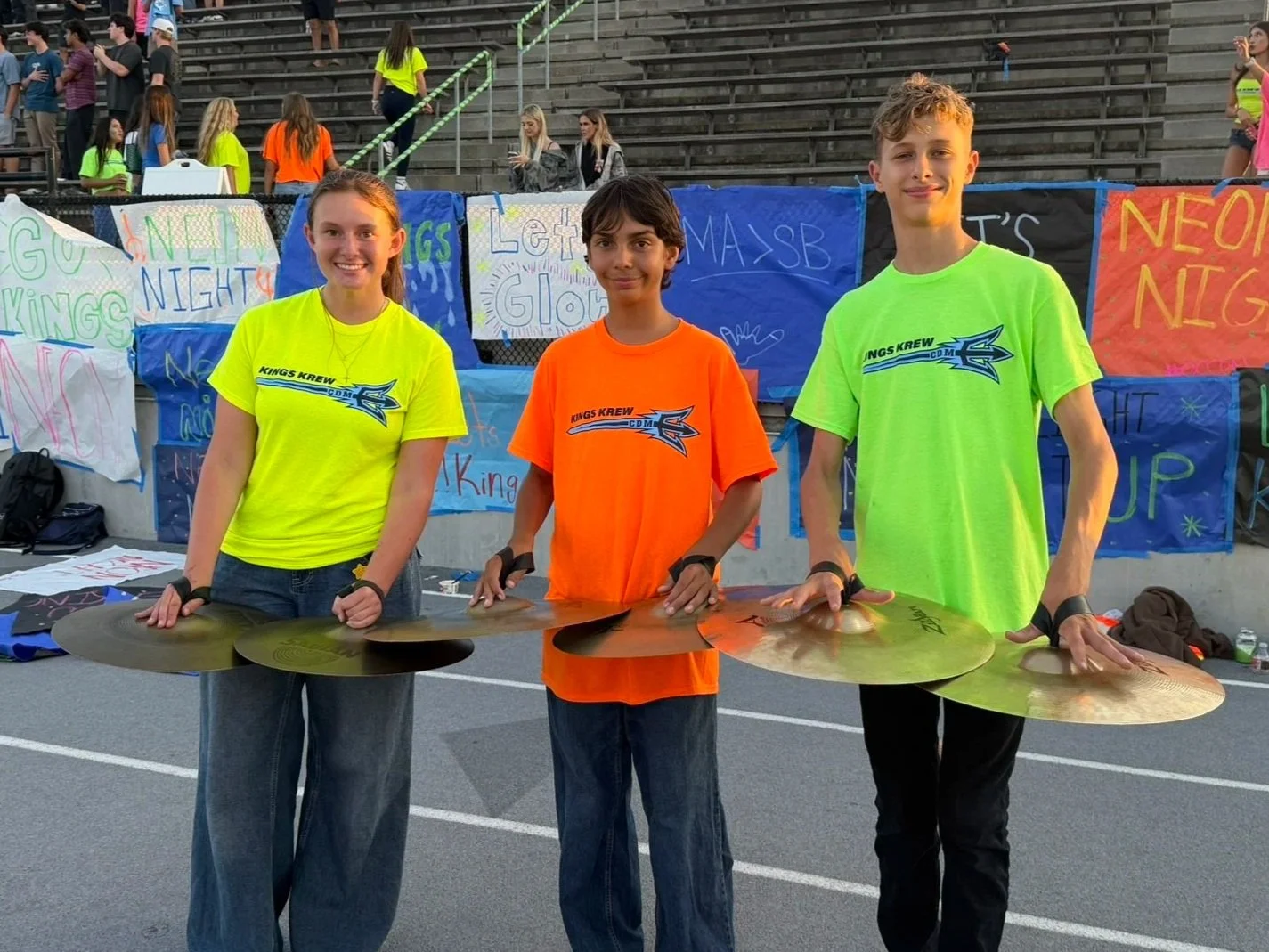 The cymbals of the CdM Drumline performing at the first home football game of 2026.