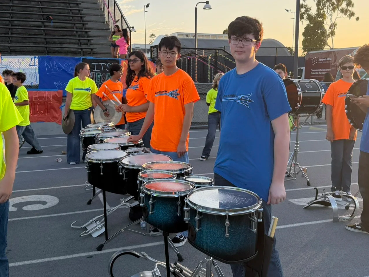 The tenor line of the CdM Drumline performing at the first home football game of 2026.