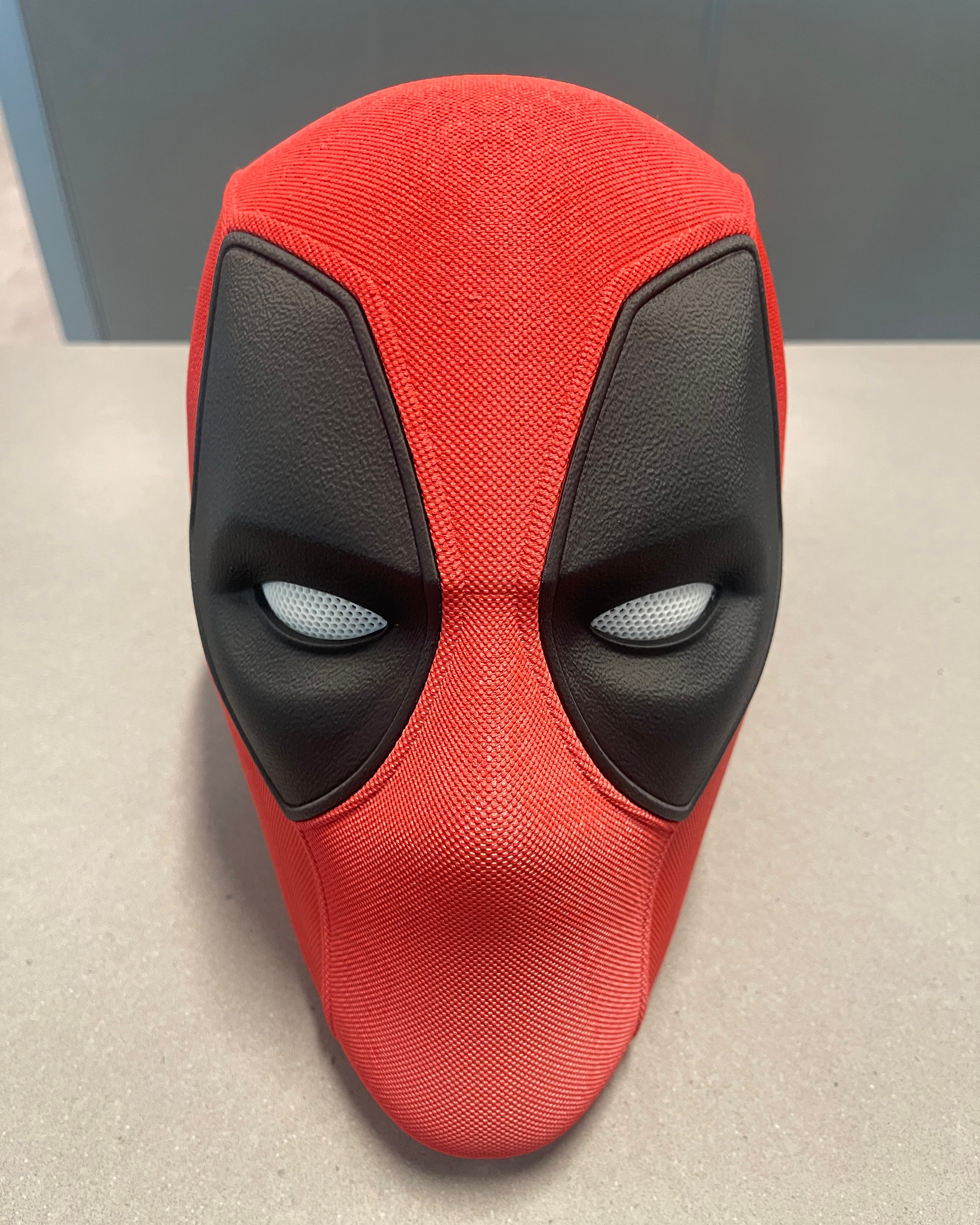 Slightly elevated front view of the completed Deadpool mask showing the overall shape and symmetrical eye assemblies