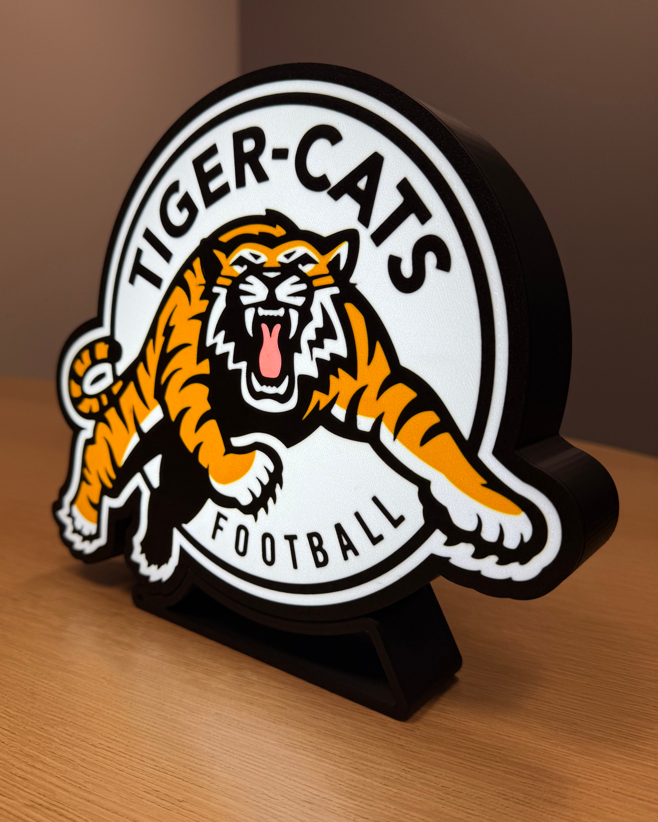 Illuminated angled view of the Hamilton Tiger-Cats lightbox with warm ambient lighting