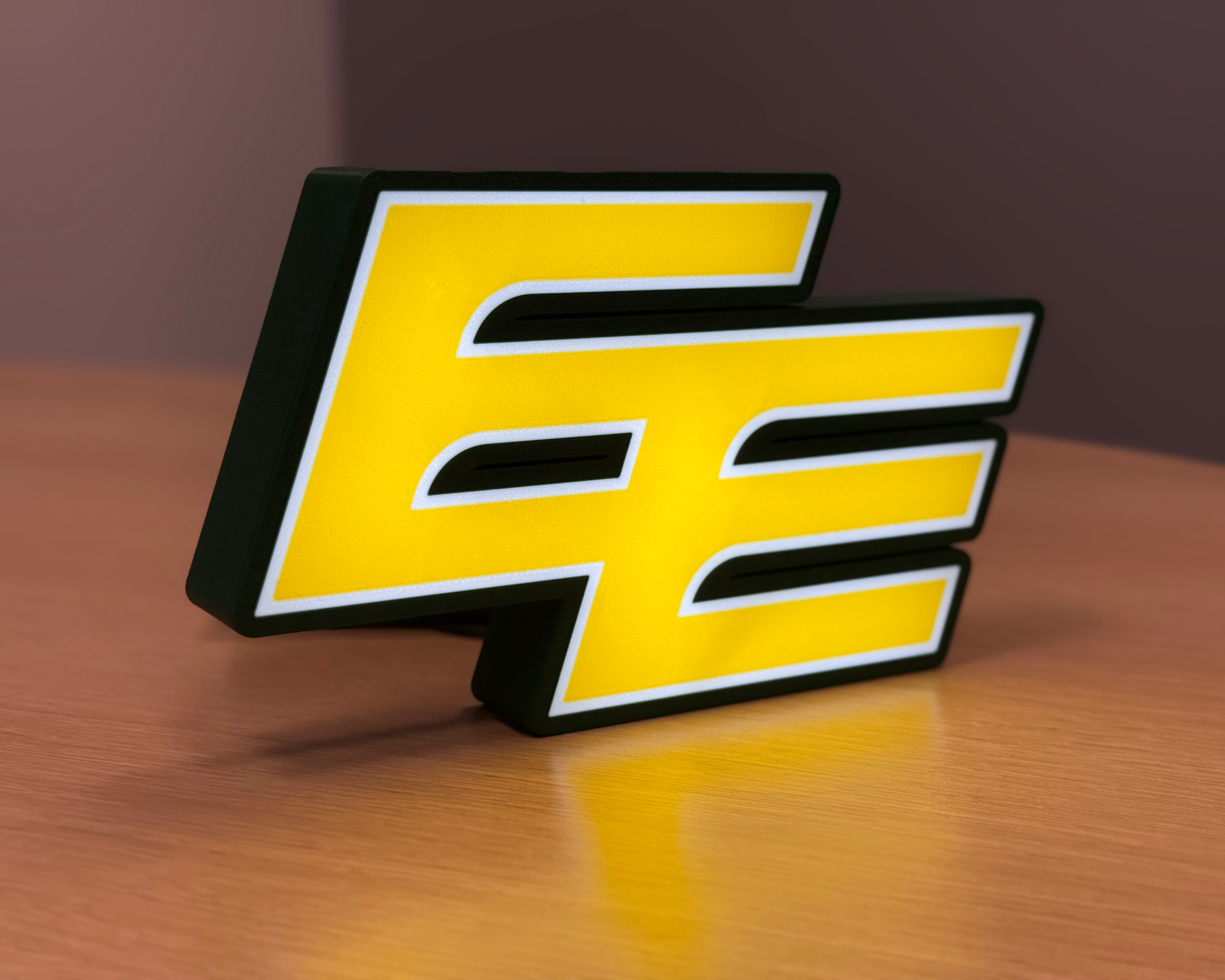 Illuminated angled view of the Edmonton Elks lightbox with warm ambient lighting