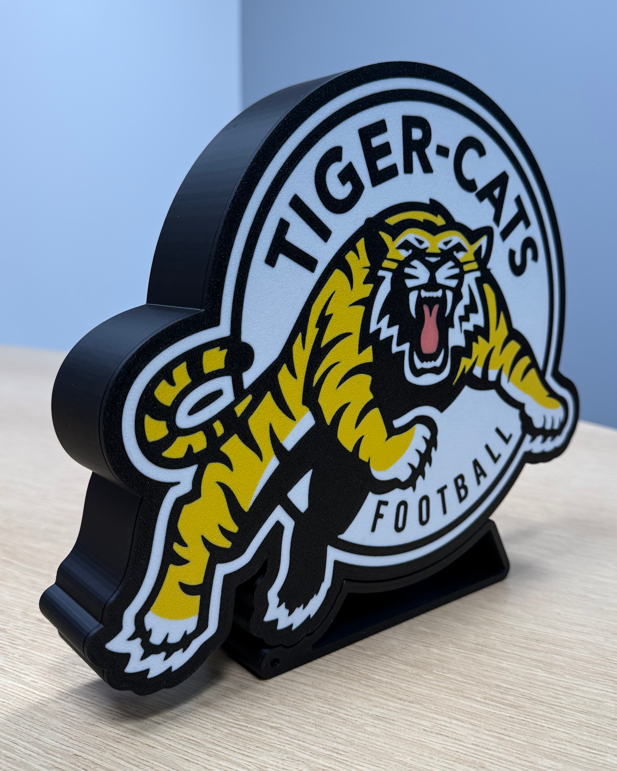 Angled view of the Hamilton Tiger-Cats lightbox showing the depth of the 3D-printed housing and display stand