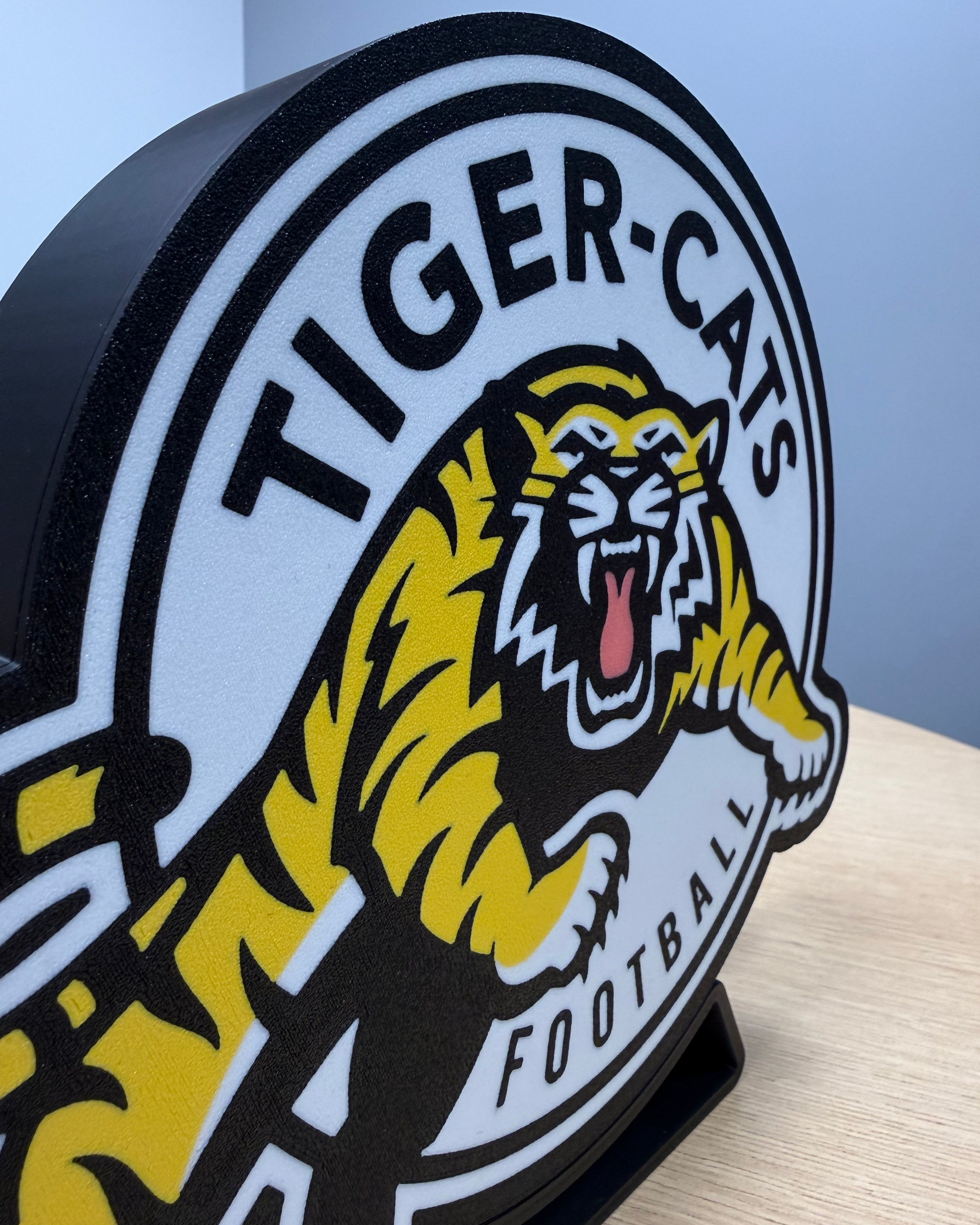 Close angled view of the Hamilton Tiger-Cats lightbox showing the layered face construction and housing depth