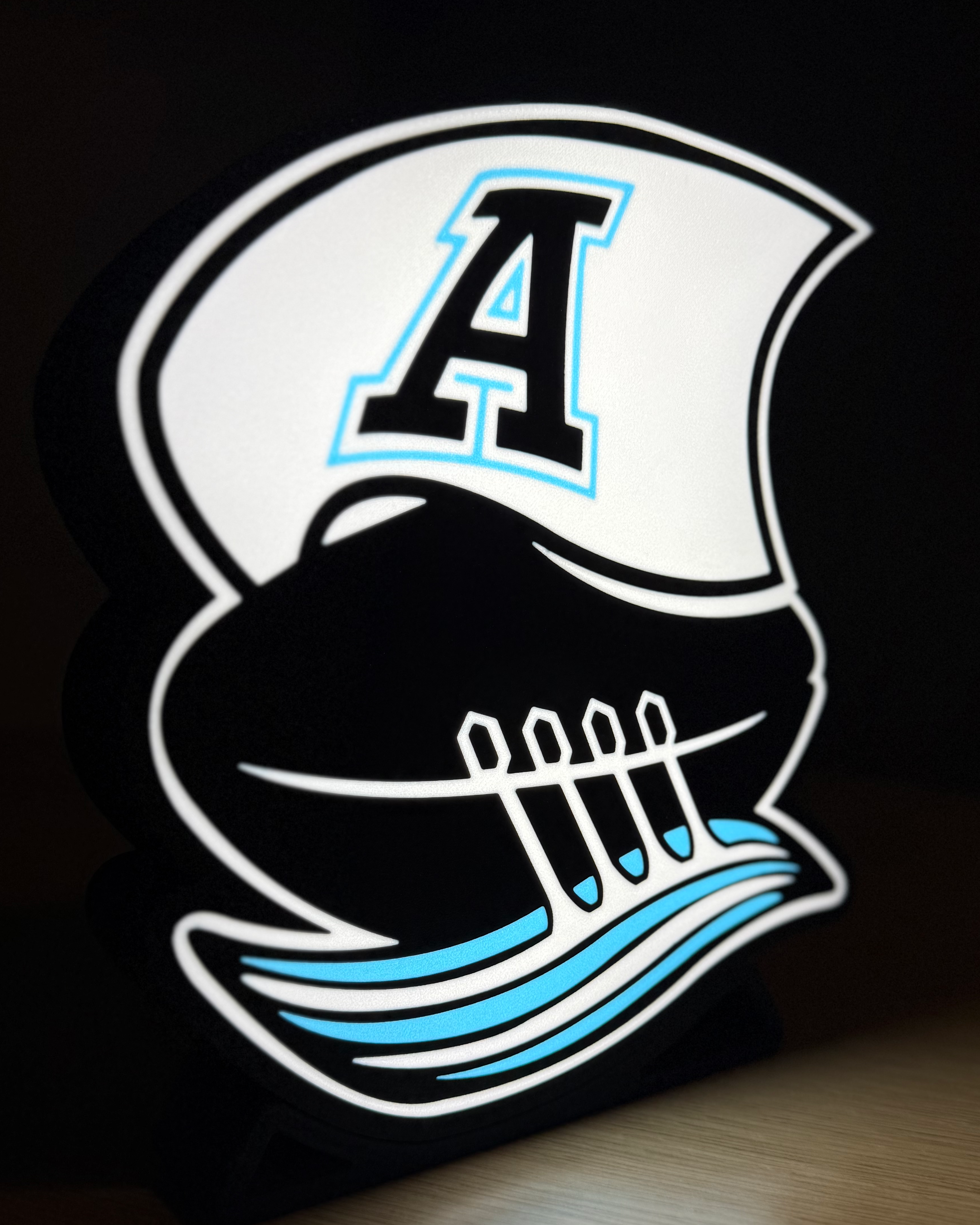 Illuminated Toronto Argonauts lightbox displayed on its stand against a dark background