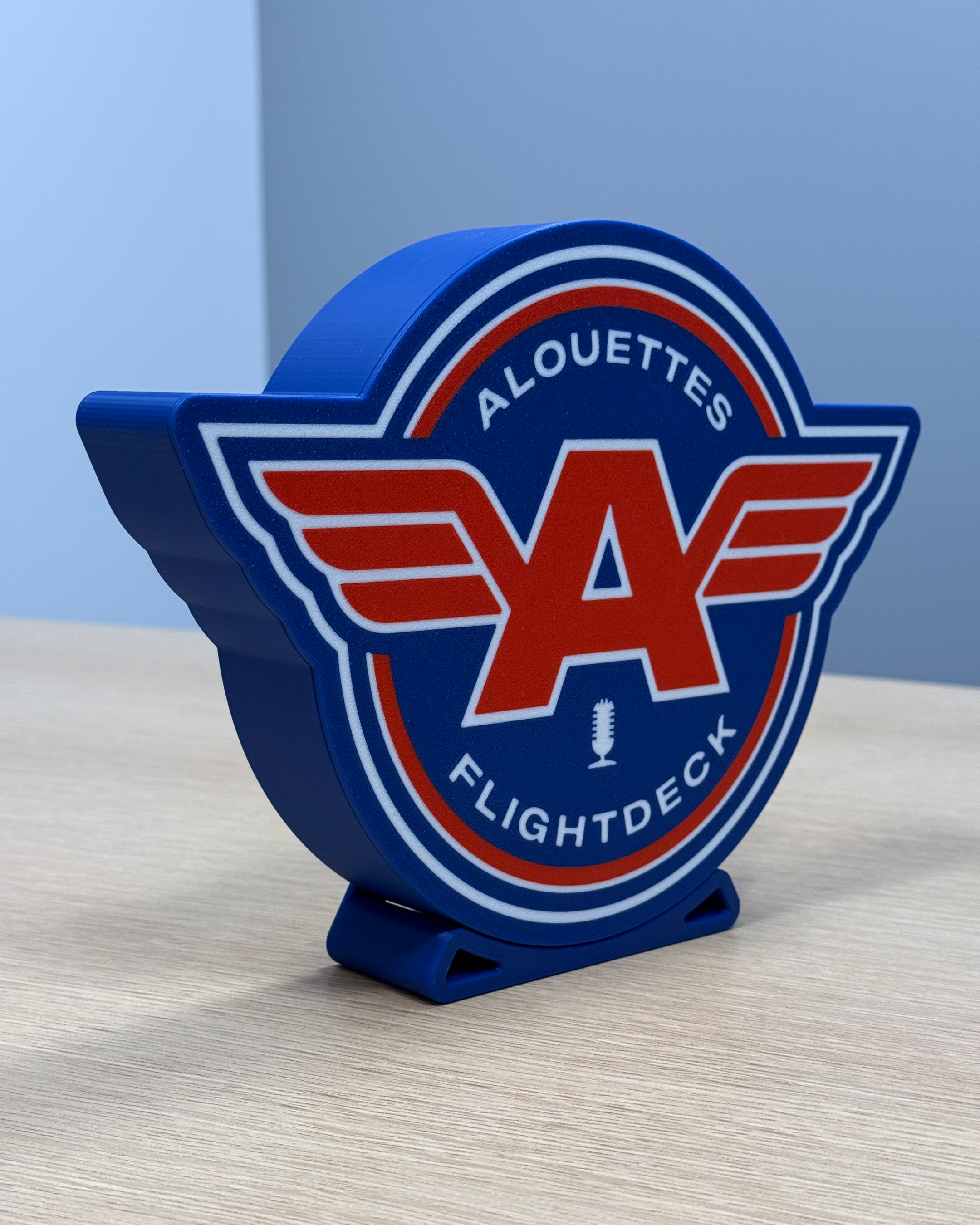 Angled view of the Alouettes Flightdeck Podcast lightbox showing the depth of the 3D-printed housing and display stand