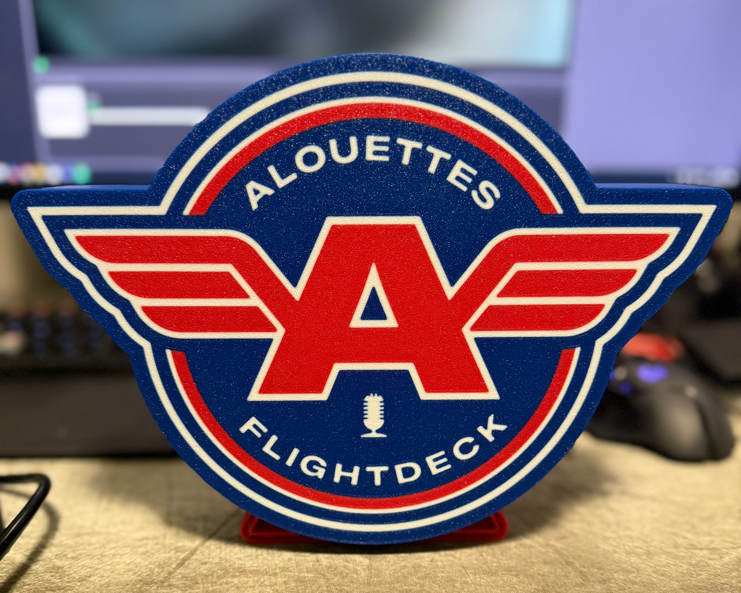 Front view of the Alouettes Flightdeck Podcast lightbox displayed unlit on its stand