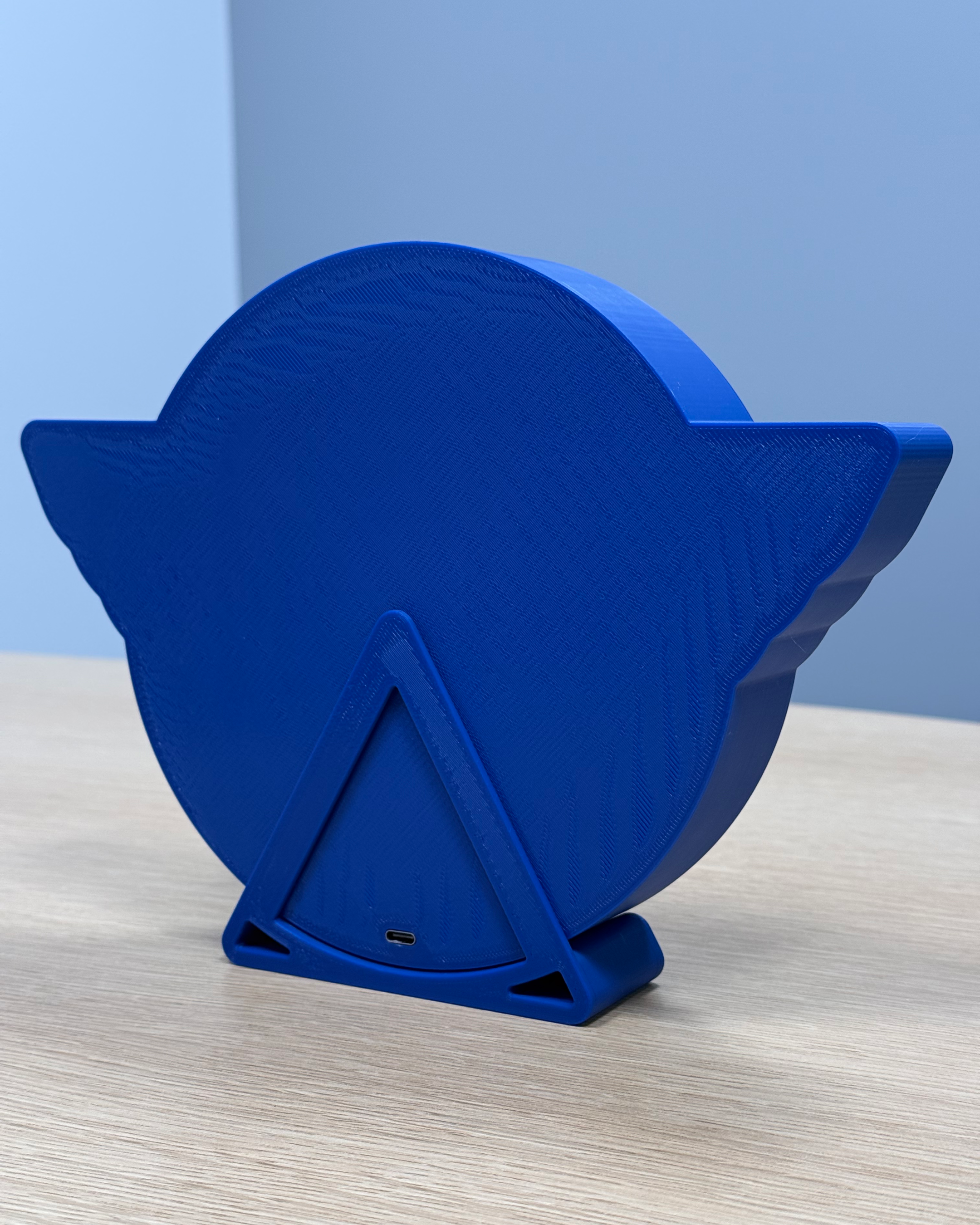 Rear view of the Alouettes Flightdeck Podcast lightbox showing the 3D-printed enclosure, stand, and USB-C power connection