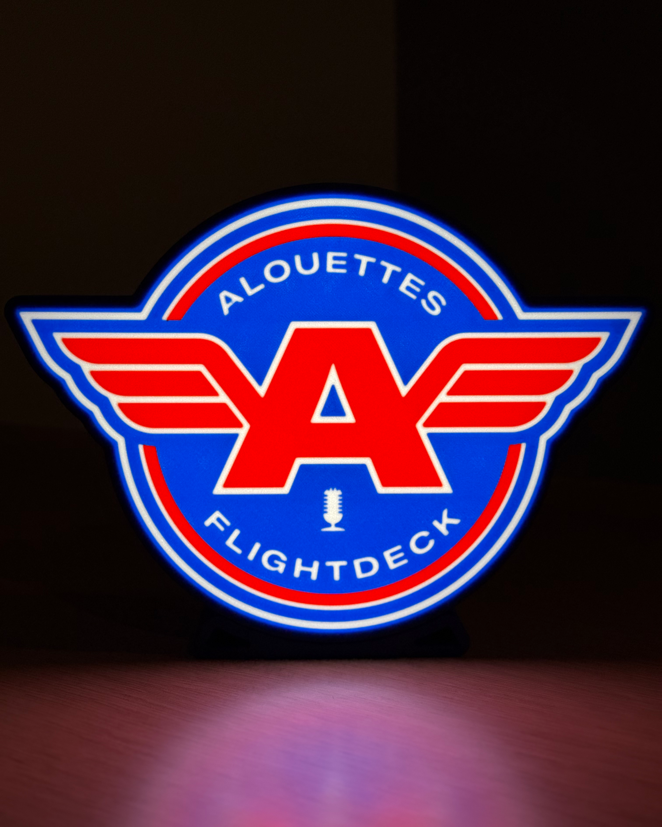 Illuminated front view of the Alouettes Flightdeck Podcast lightbox against a dark background