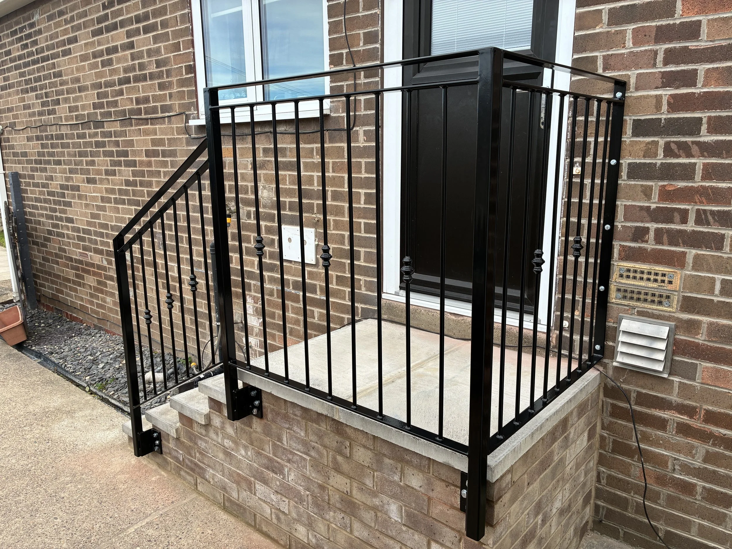 Bespoke steel handrail, manufactured and installed by Sharland Steelworks in Mapplewell, Barnsley, South Yorkshire. Made to measure to provide safe, reliable support when using steps, combining practical functionality with quality craftsmanship and a