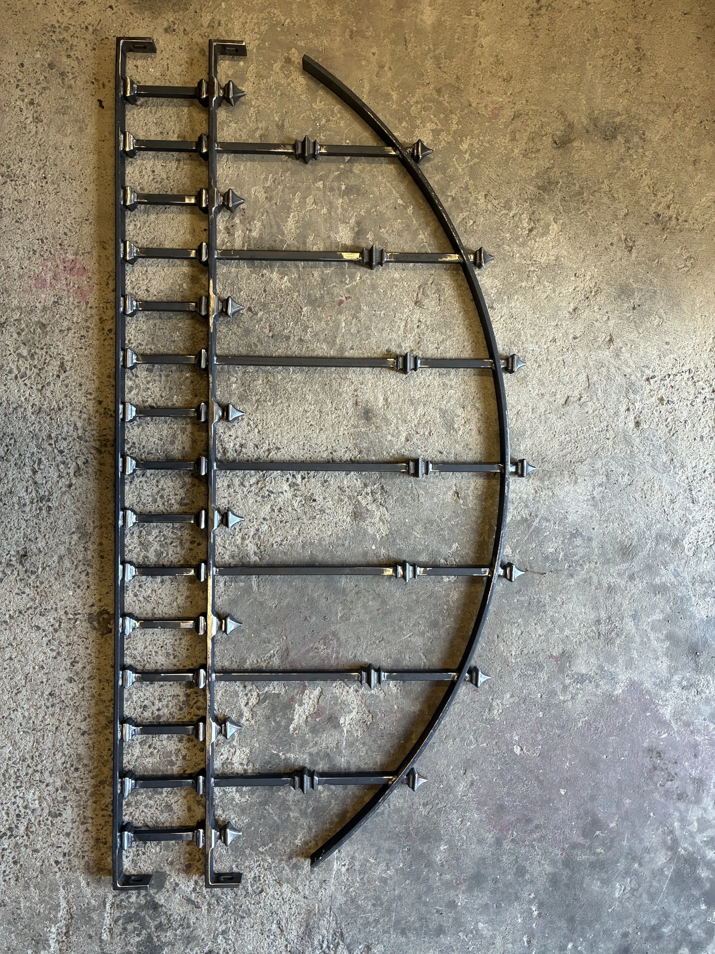 Arch top victorian railing during production before galvanising and powder coating.