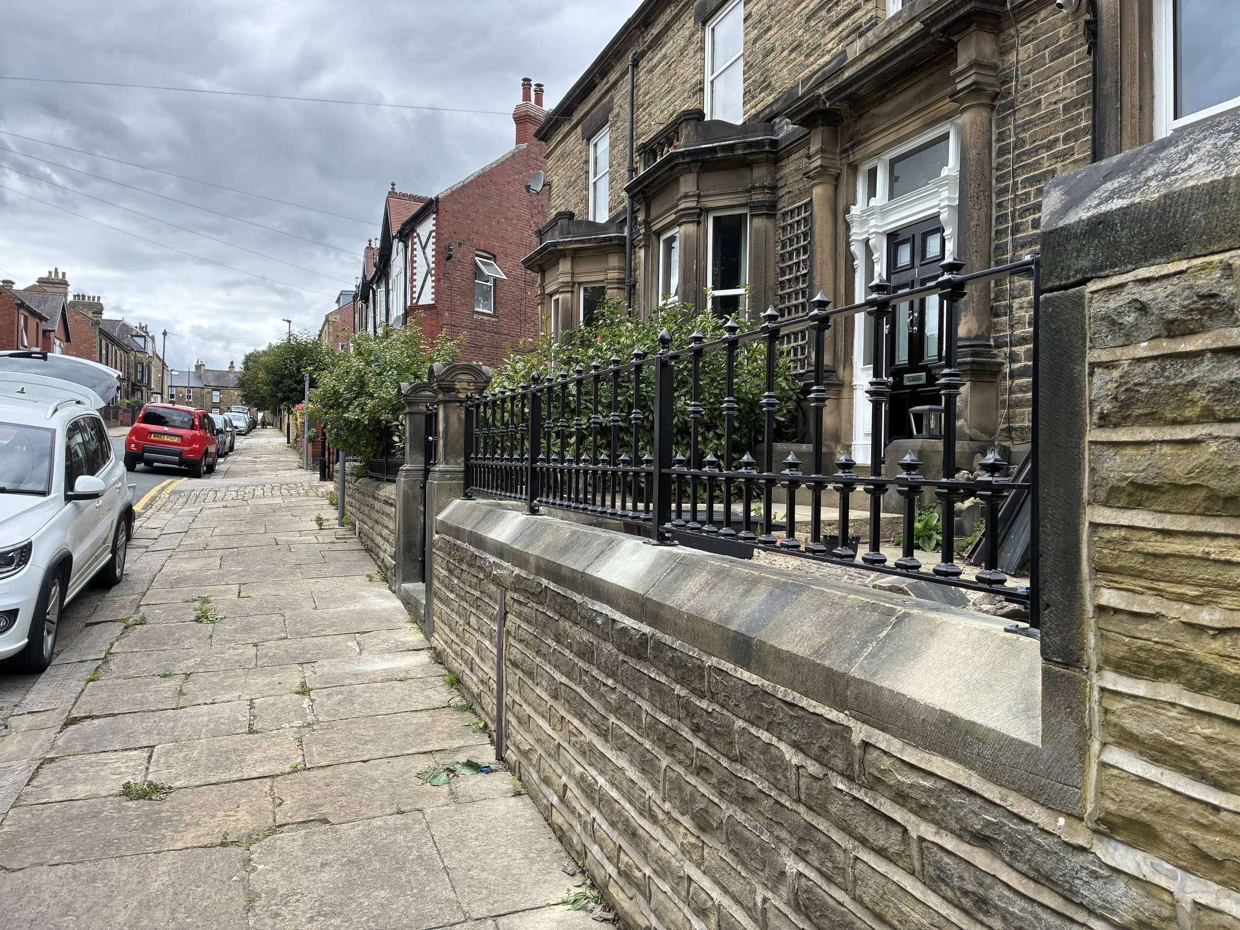 Bespoke Victorian-style wrought iron railings, manufactured and installed by Sharland Steelworks in Barnsley, South Yorkshire. Featuring traditional decorative ironwork and elegant heritage-inspired detailing, combining classic Victorian styling with