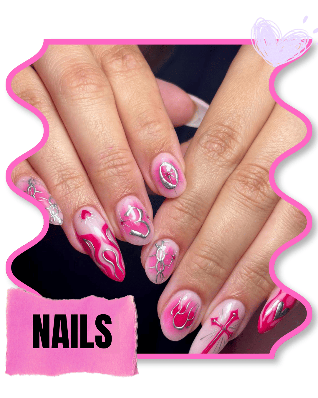 Decorative nails painted pink and white with silver designs, including a crown, heart, and lightning bolt, on a person's fingers.