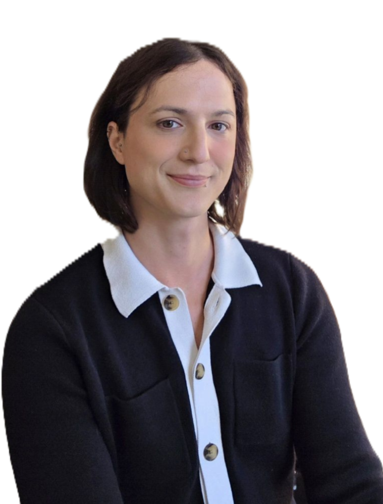 A woman with short brown hair, wearing a black cardigan over a white collared shirt, smiling slightly, with a neutral background.