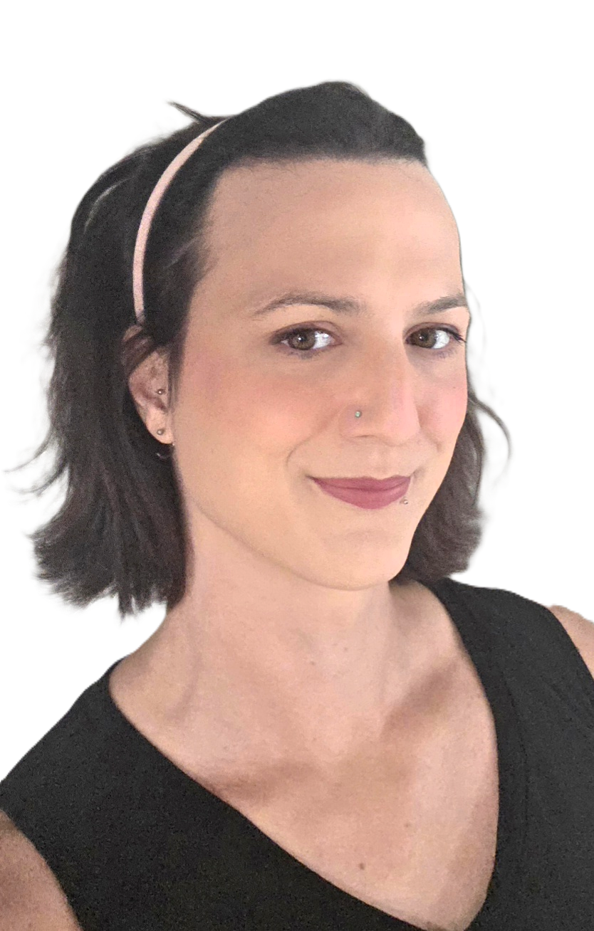 A woman with shoulder-length dark hair, wearing a pink headband and a black sleeveless top, smiling slightly.