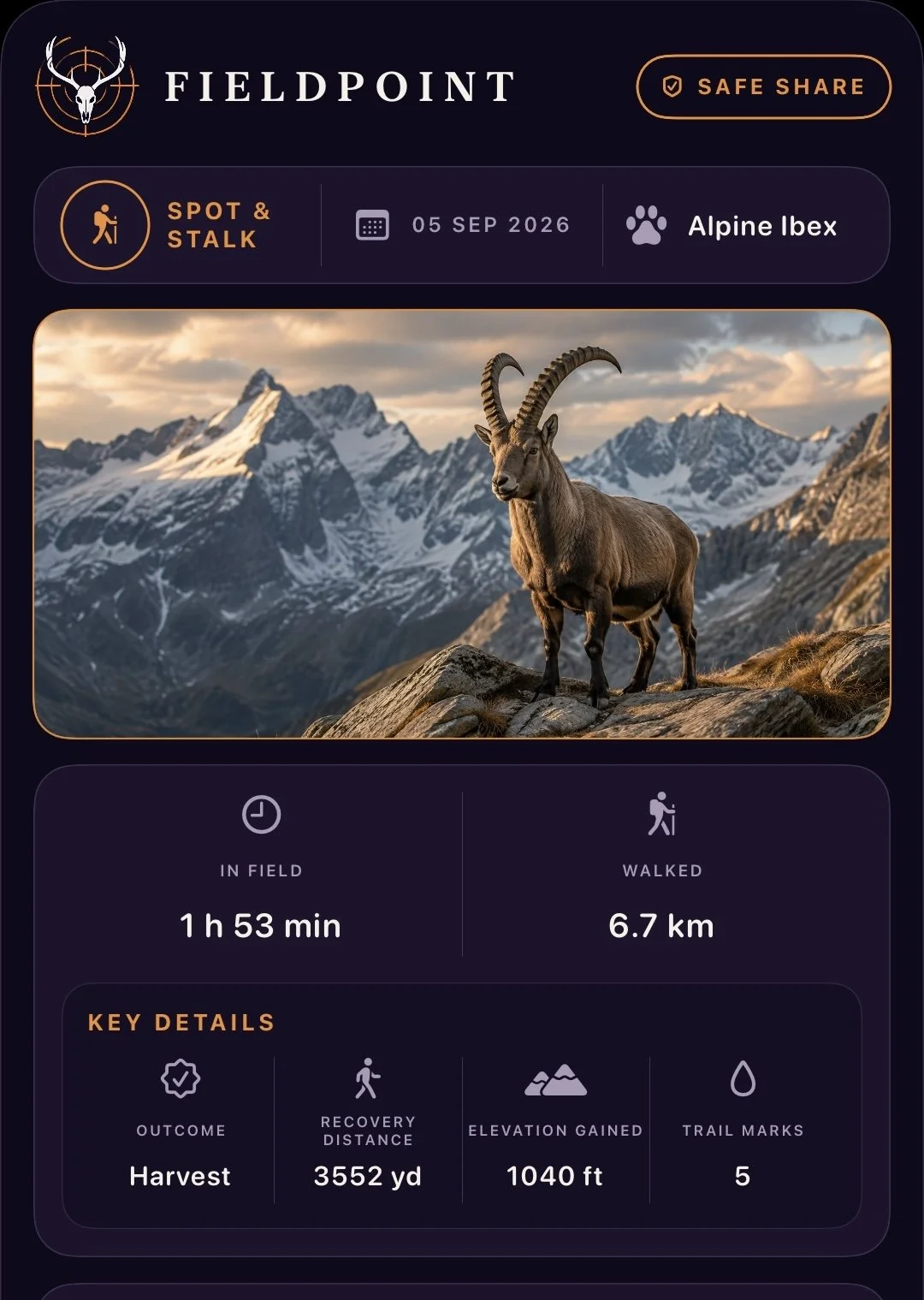 A mountain goat with large, curved horns standing on rocky terrain in front of snow-capped mountains during sunset.
