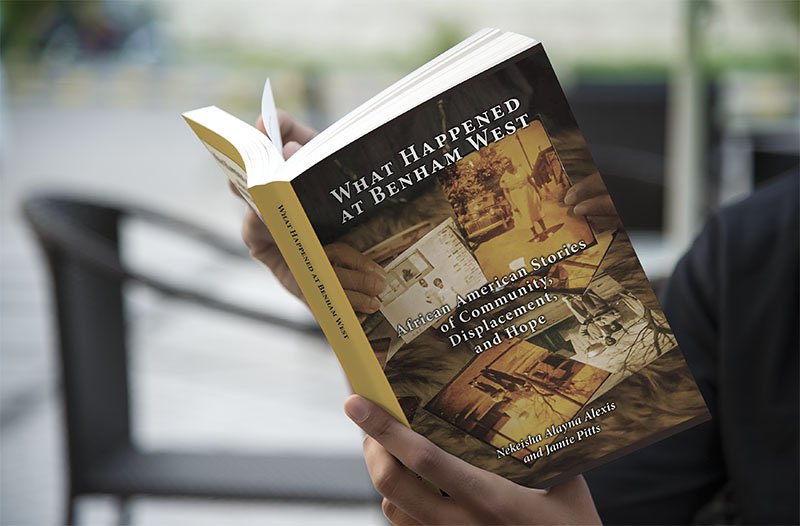 Person reading a book that is designed