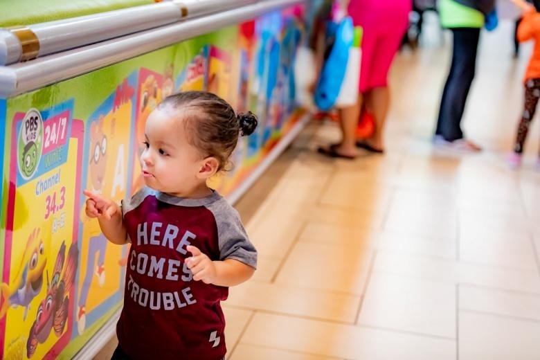 A small child interacting with play space ABCs