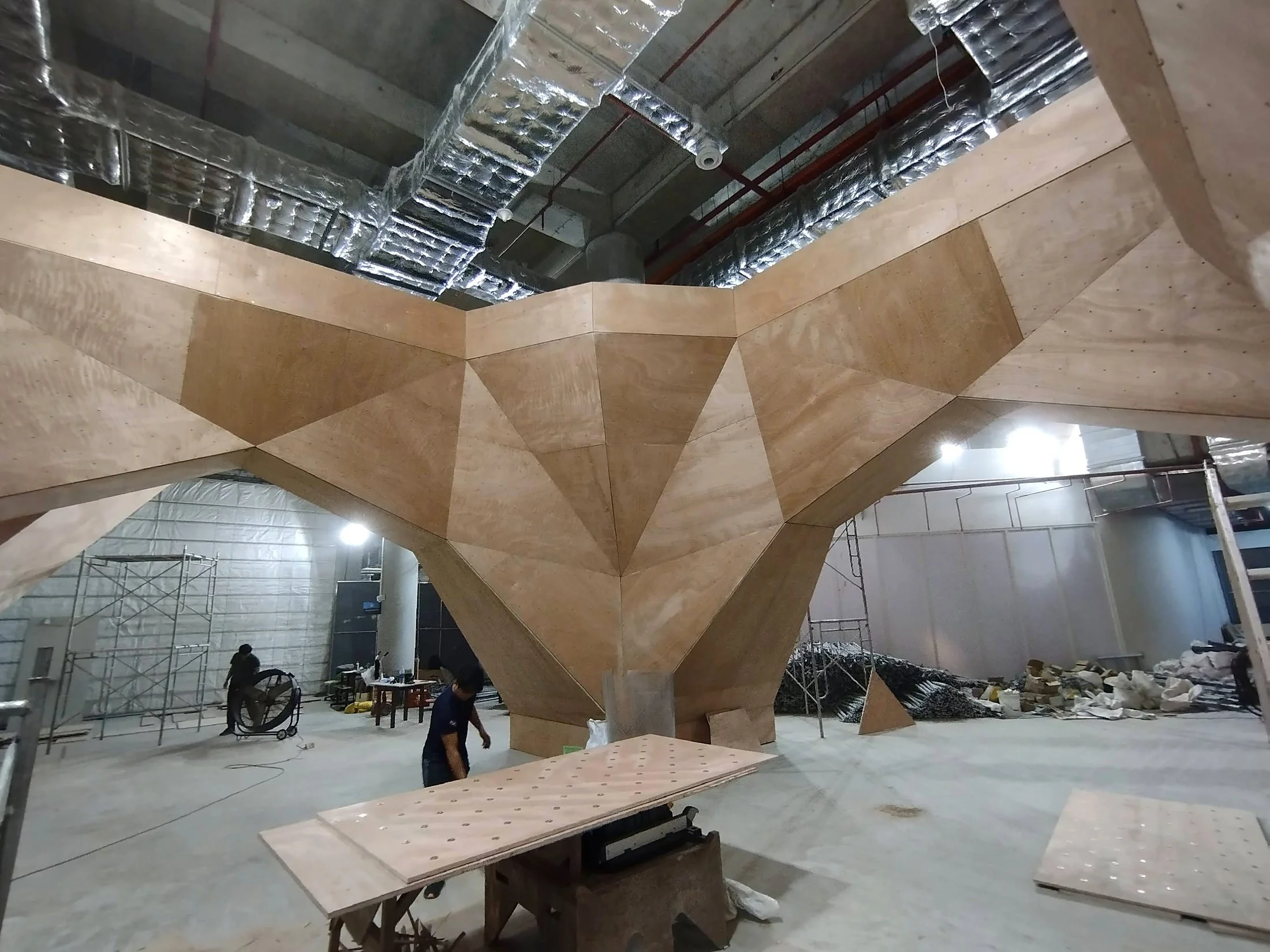 Bouldering wall plywood sheeting onto a steel backed frame.