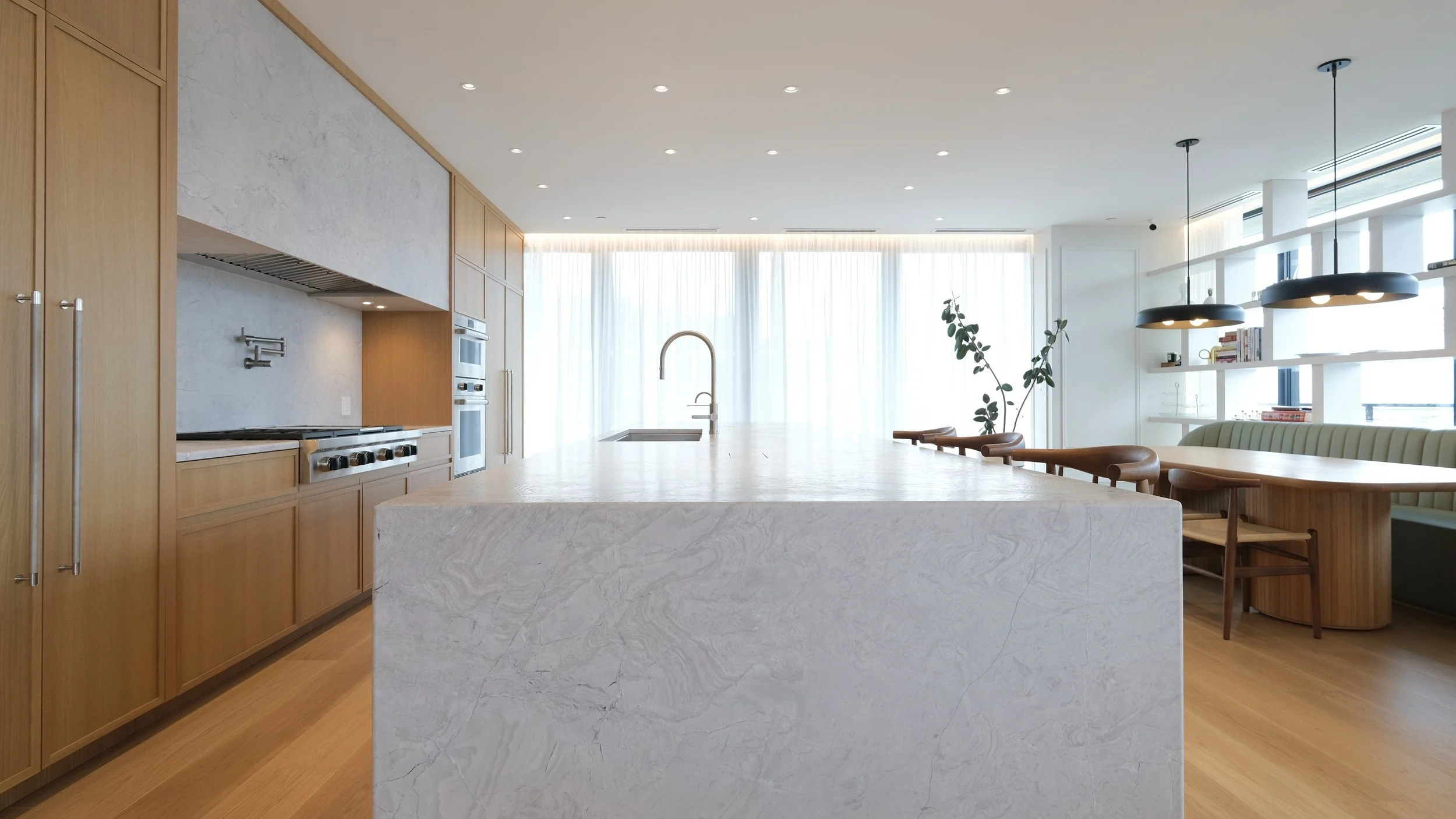 Custom kitchen island in the French Velours penthouse by Chrome Design in Griffintown, Montreal