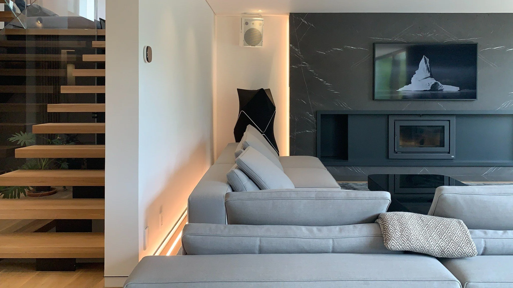 Lazard living room with stone fireplace by Chrome Design in Montreal