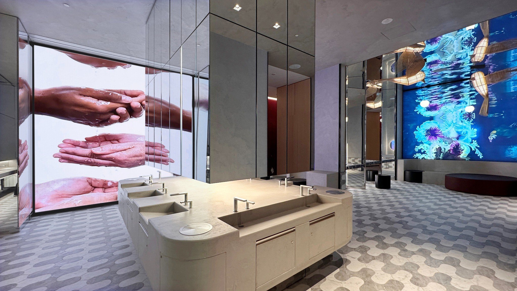 Art installation and accessible vanity area in the inclusive bathroom at Royalmount in Montreal by Chrome Design and Borrallo Interiors