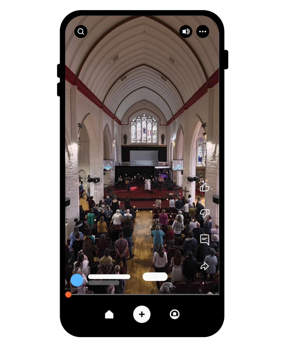 Interior of a church with a congregation attending a service or event, with a stage and musicians, stained glass windows, and high vaulted ceilings.